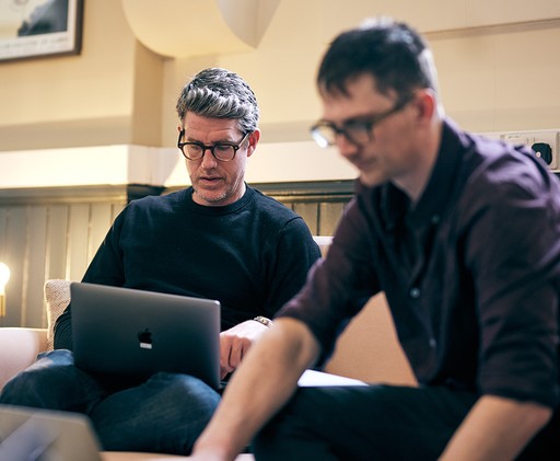 A man looking at a laptop