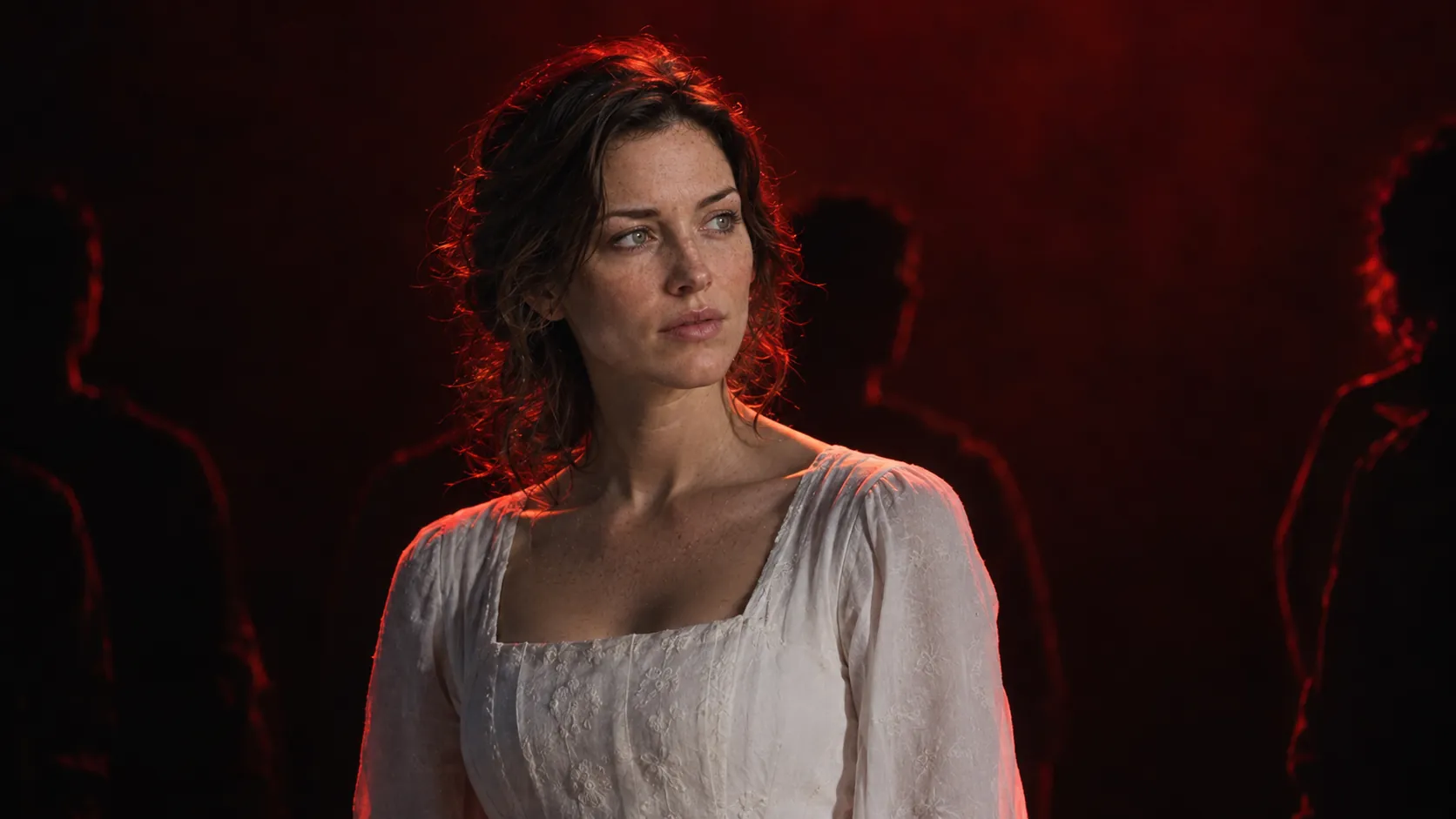 Ada as the Bride in white under red stage light