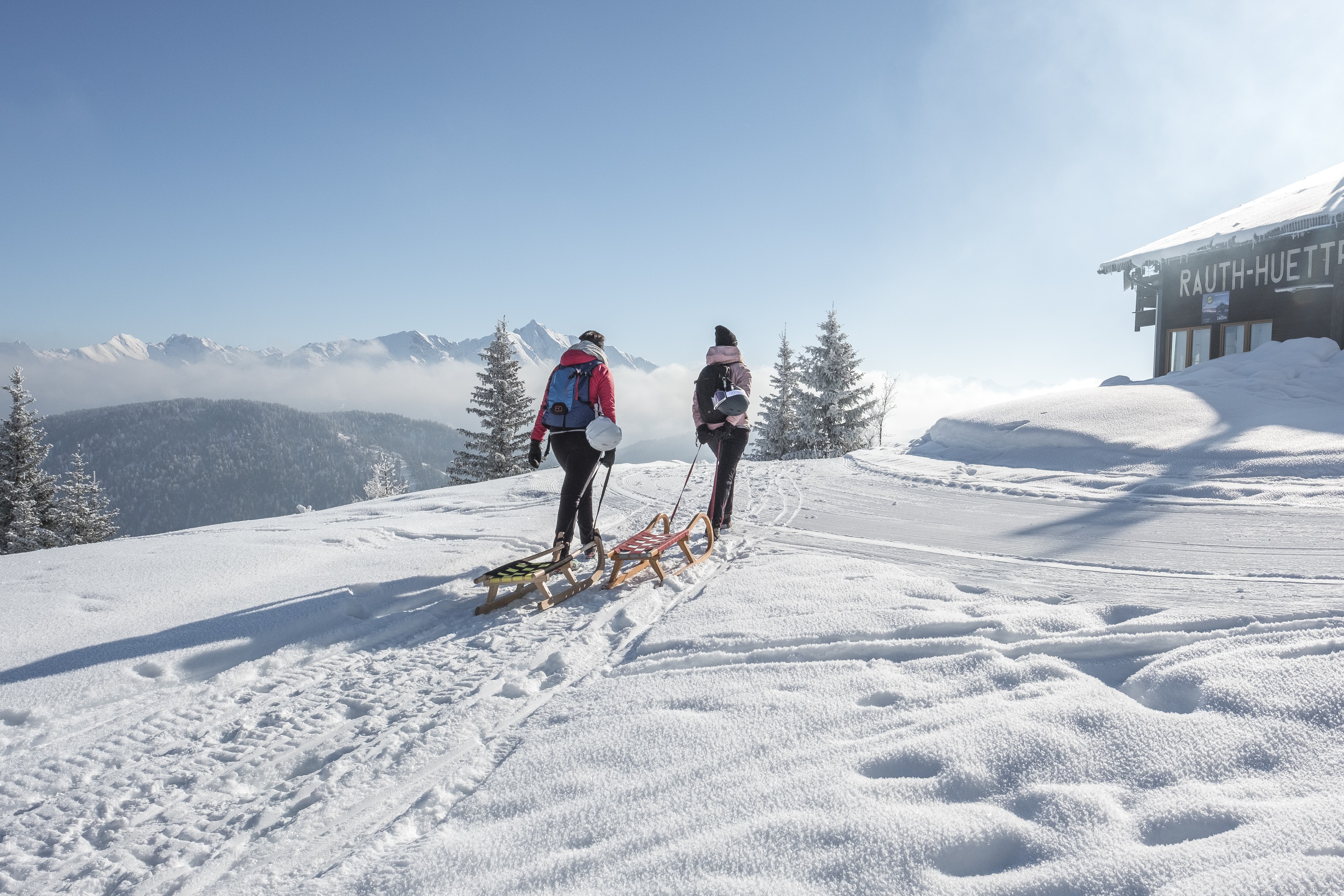 living room area with coffee table and green velvet sofa