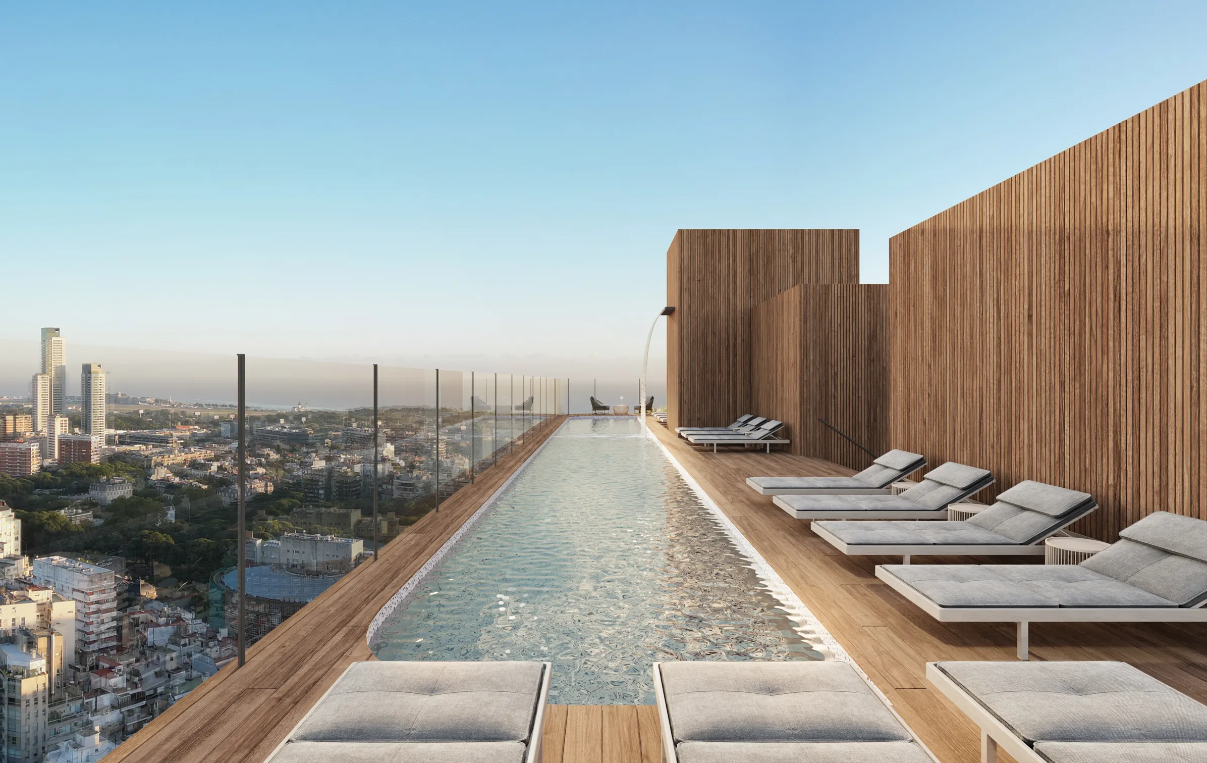 Piscina infinita en rooftop con tumbonas, deck de madera y vistas a la ciudad