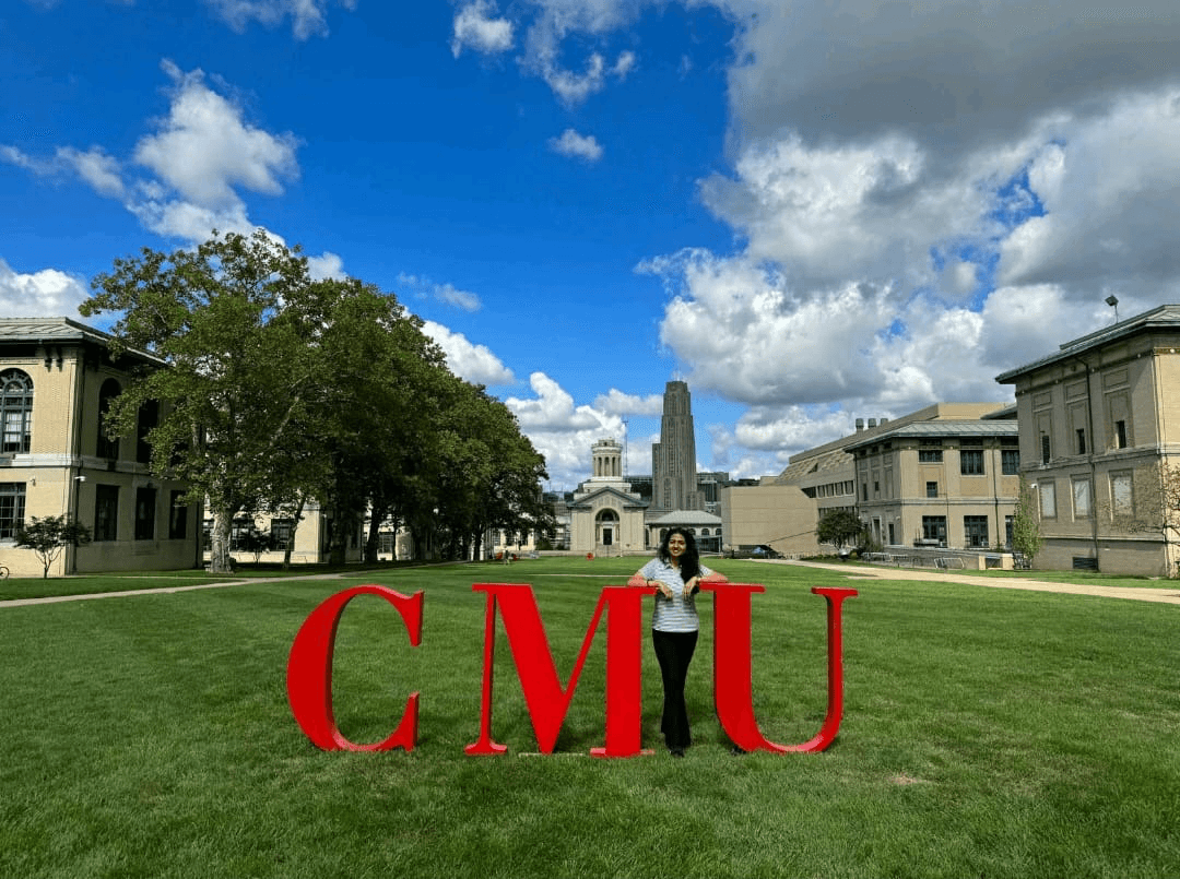 a group of people walking on a sidewalk