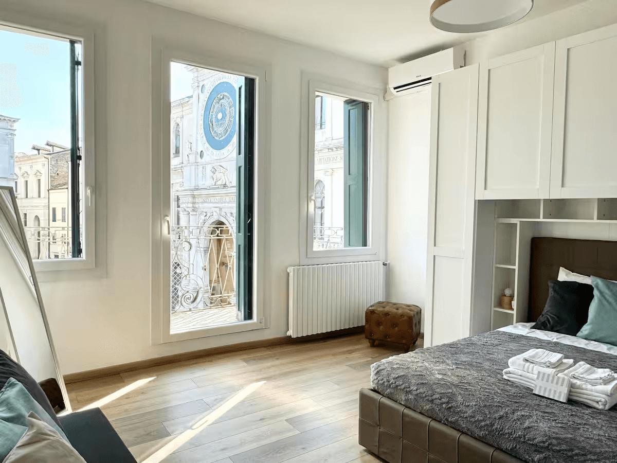 gray fabric loveseat near brown wooden table