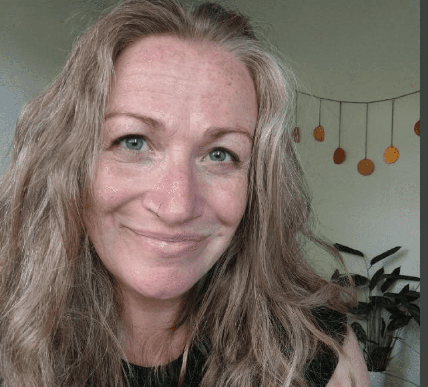 A woman in a business suit holding a folder