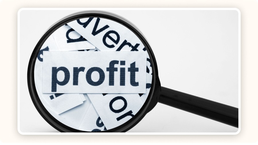 Magnifying glass over the word profit