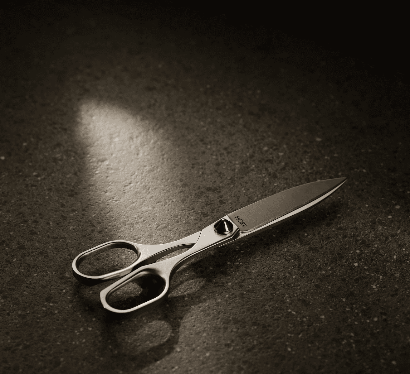 Placing the HORL® Leather Strop on a flat, stable surface in preparation for knife stropping.