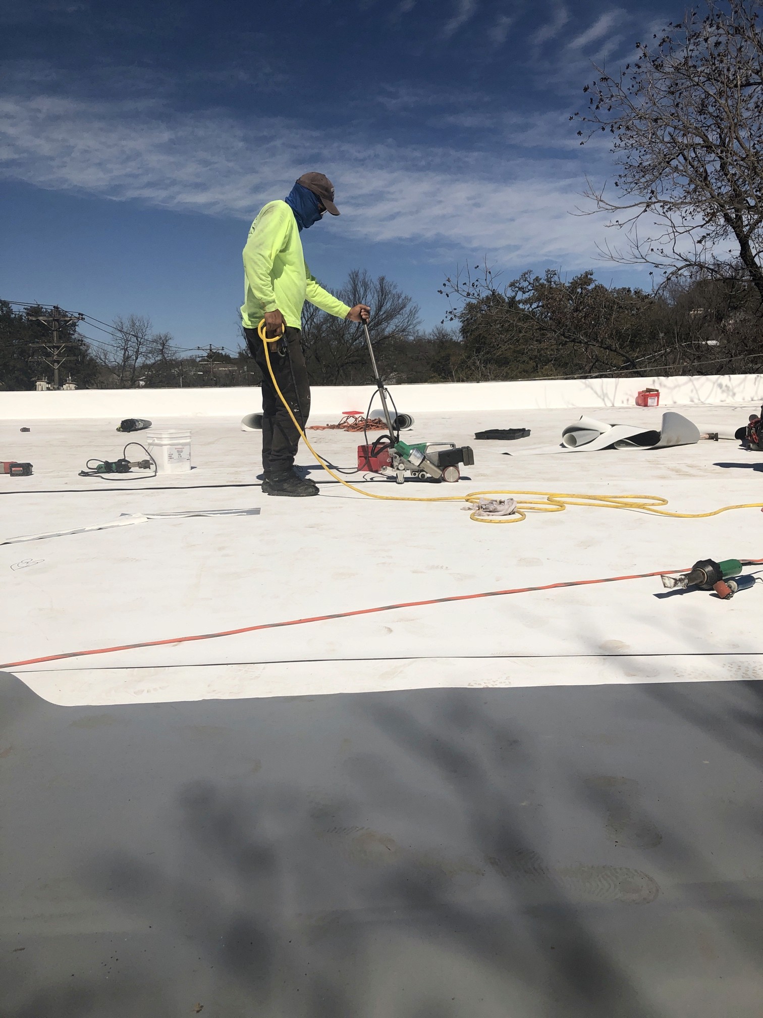 Hot Air welding a new TPO roof in Austin Texas. 