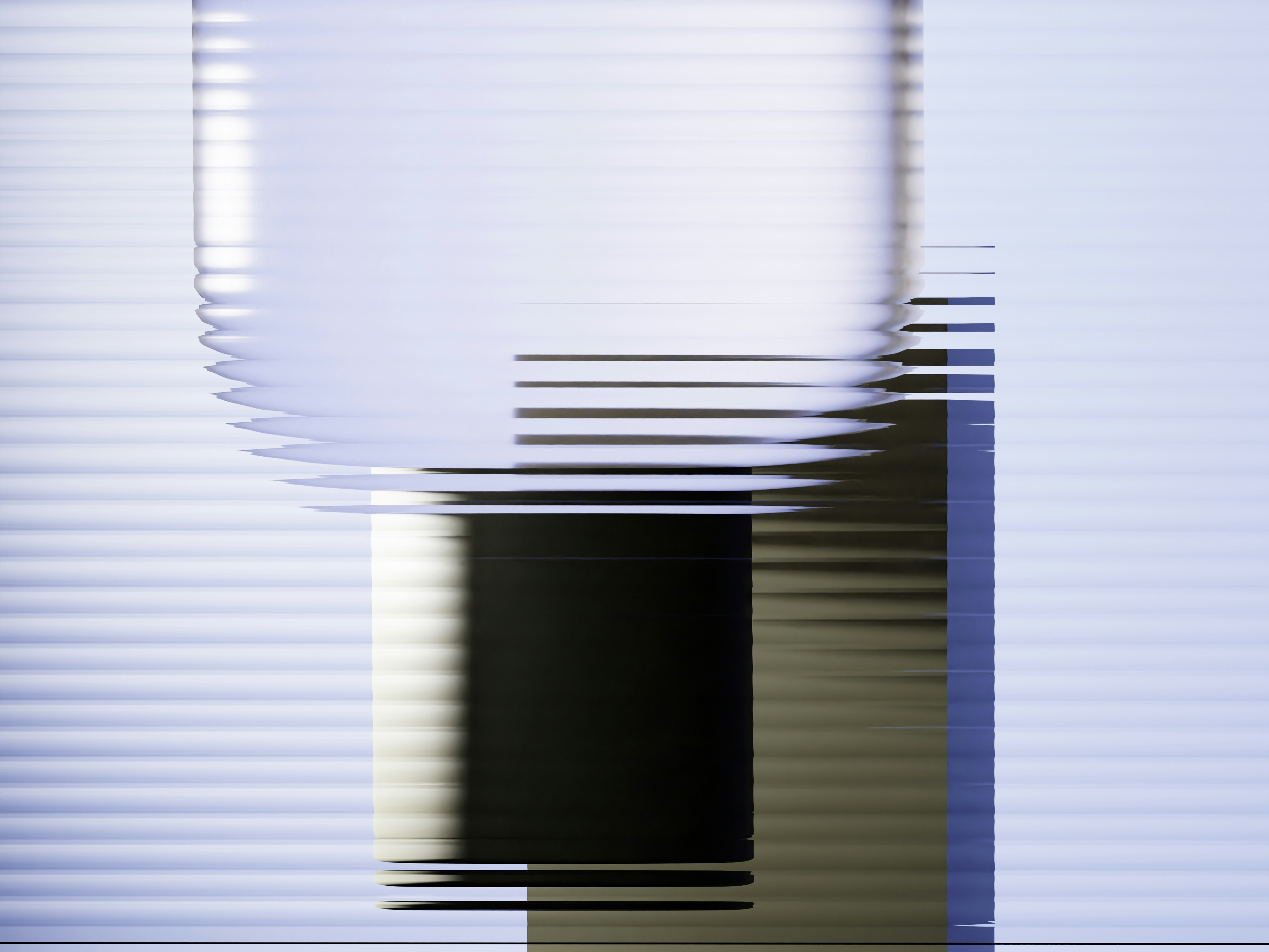 Abstract geometric shapes with color gradients are present.