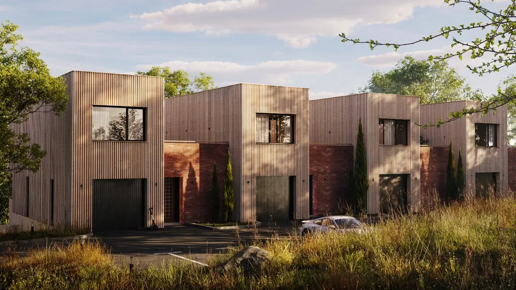 Row of modern wooden and brick townhouses surrounded by grass and trees