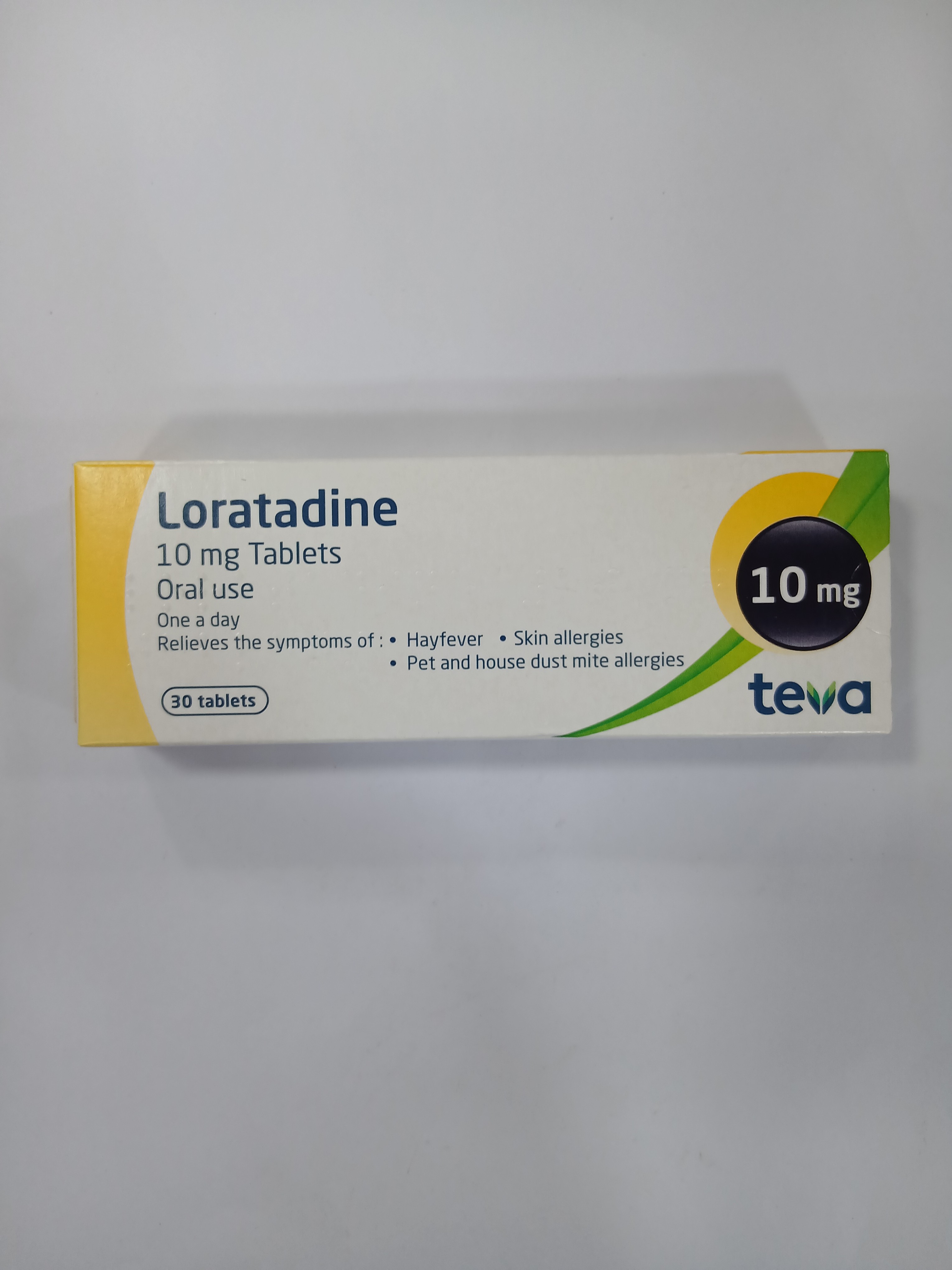 White cardboard box packaging displays a green and white label with printed text indicating "10 mg" dosage and "30 tablets," designed for oral use.