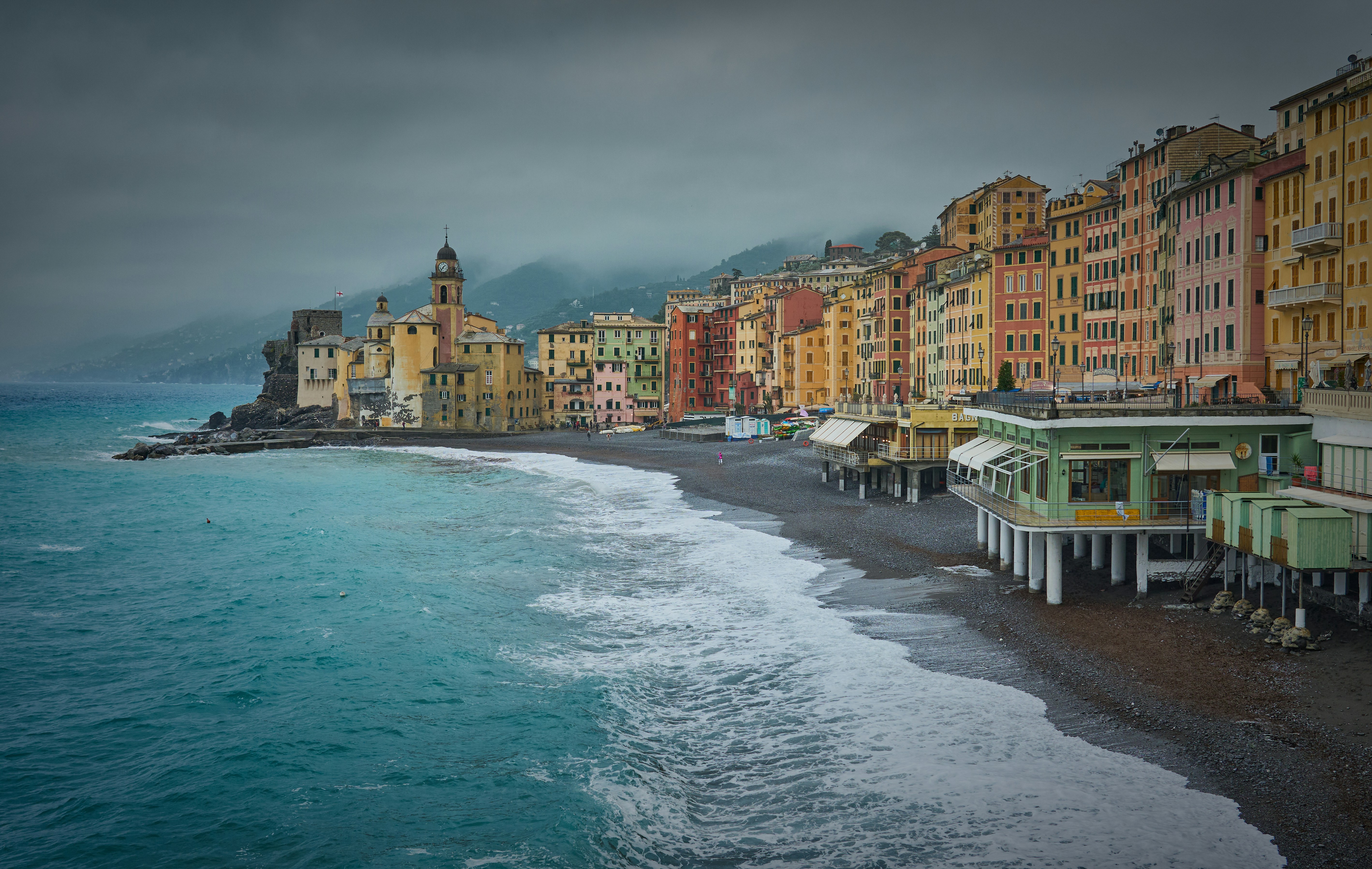 A row of buildings next to a body of water