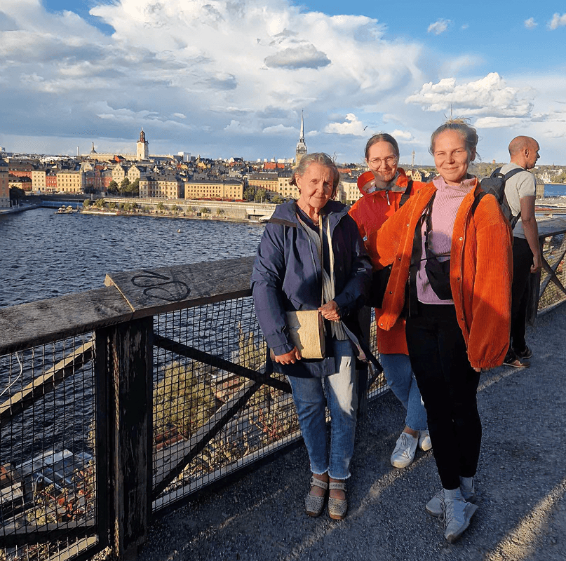 Tourists exploring Stockholm during private electric sightseeing cart tour
