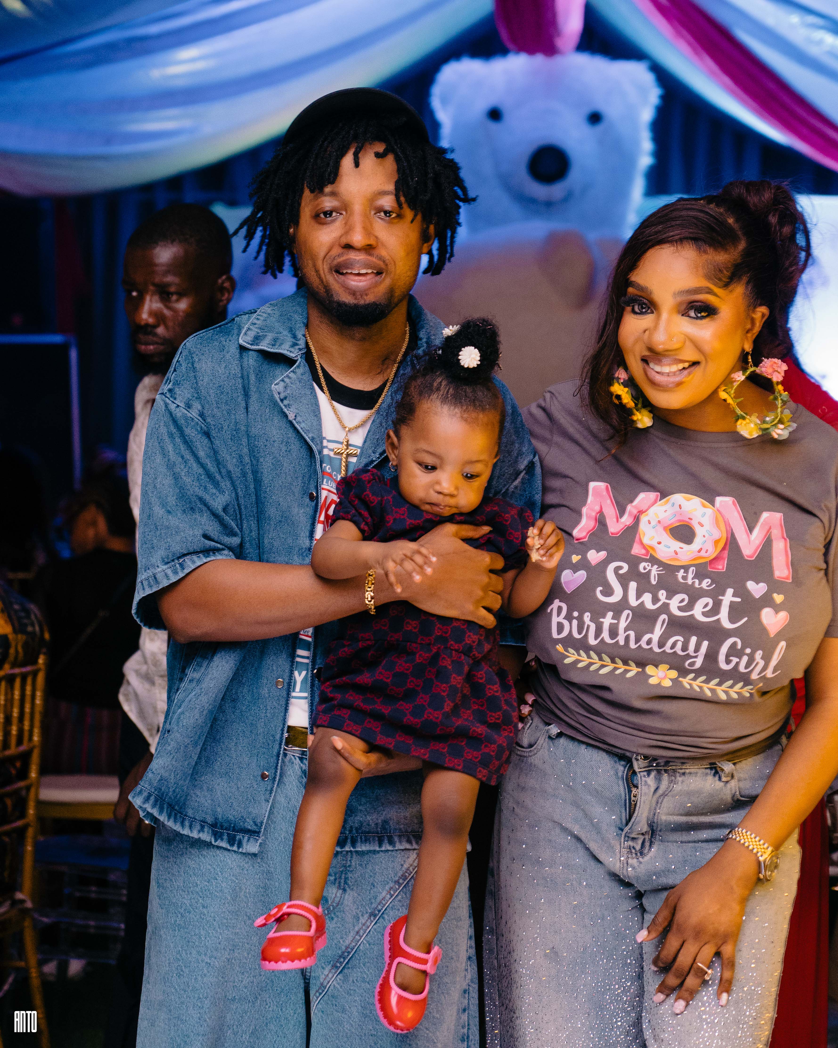 man standing near white wall