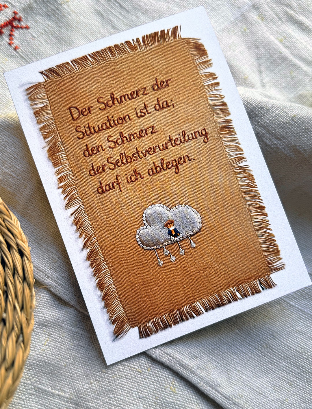 A Card with a embroidered Text