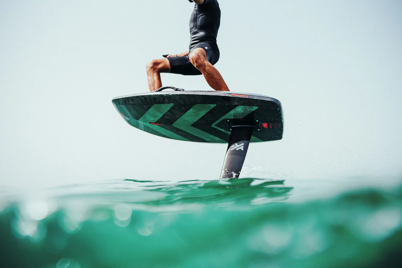 Hydrofoil surfer riding over water using Aerofoils board for high-performance water sport experience in Tarifa