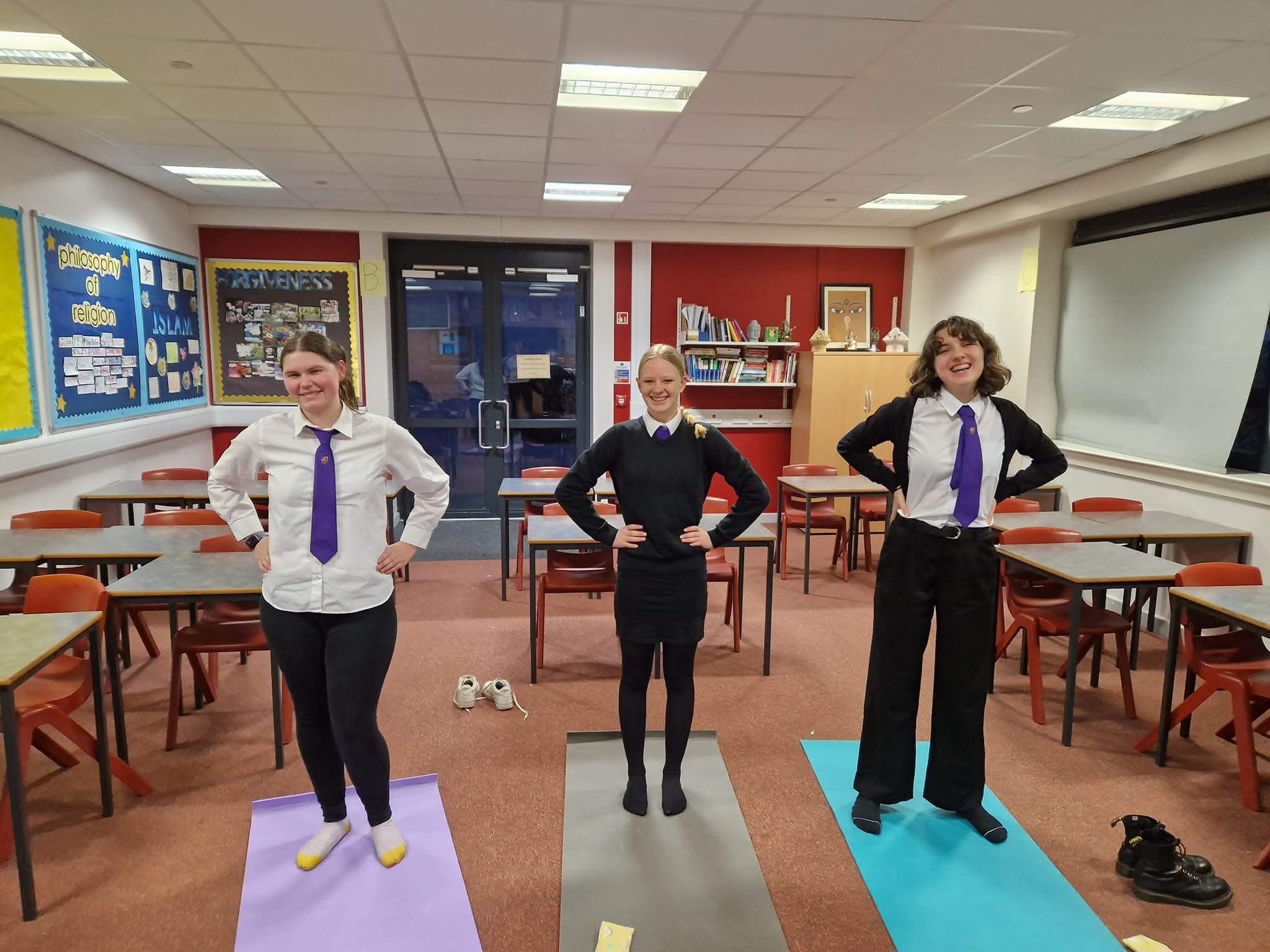 A group of 3 girls with their hands on their waist