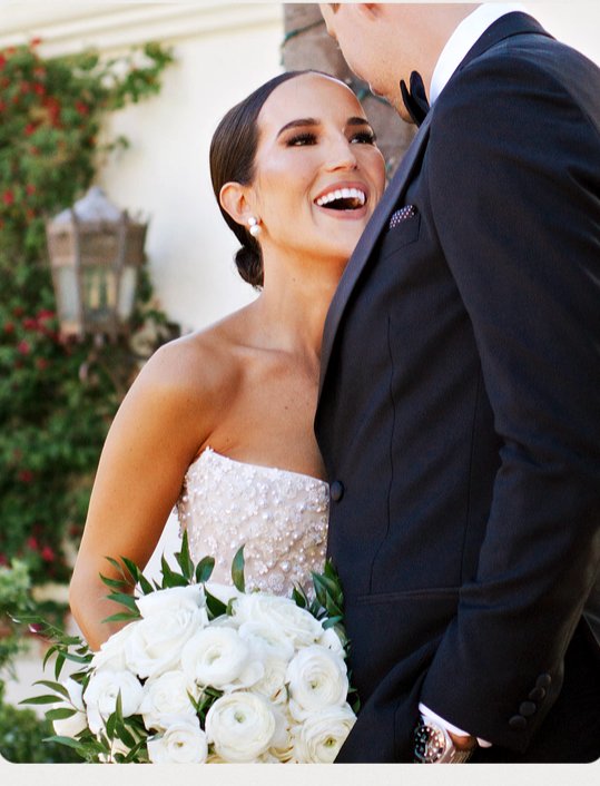 Anna laughing with Luke, white bouquet