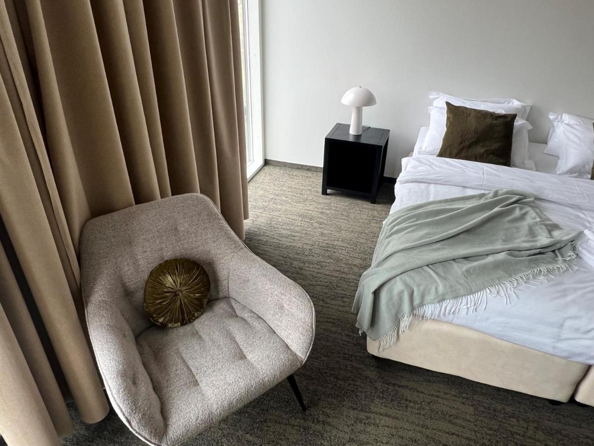 Modern decor and clean layout in Triple Room at Hotel Bifröst