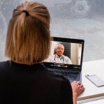 Doctor or health coach in consultation representing Eternal's real care team with full patient context