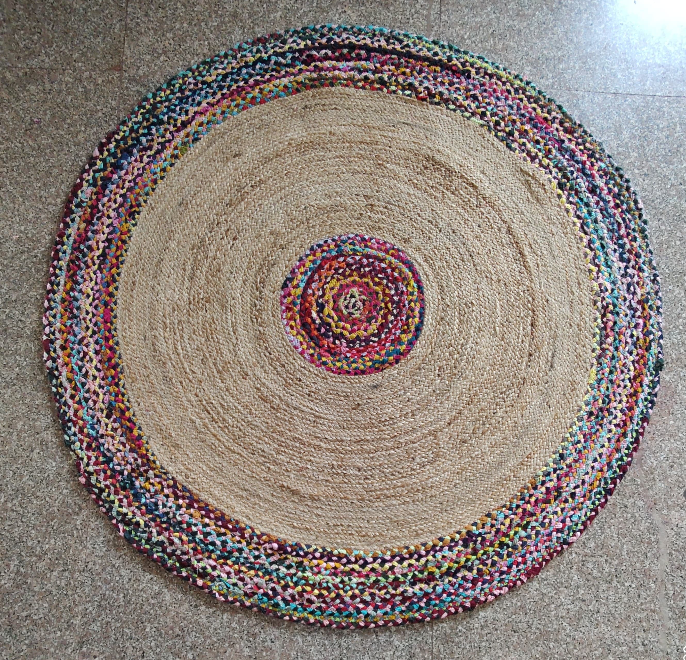 Handwoven round jute rug with multicolor center design