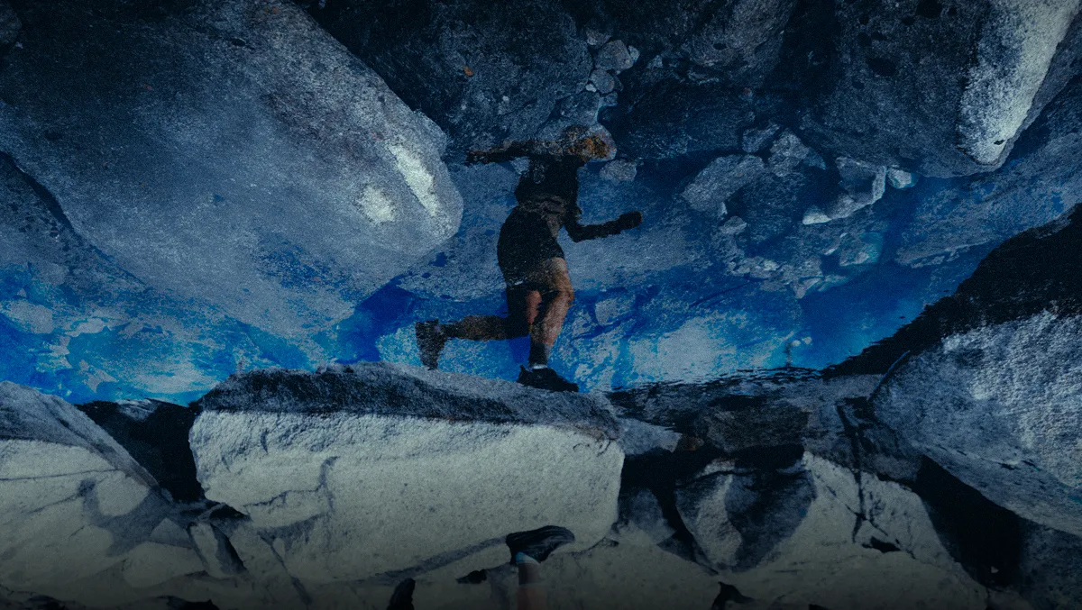 picture of a woman runnign, reflecting on ice.