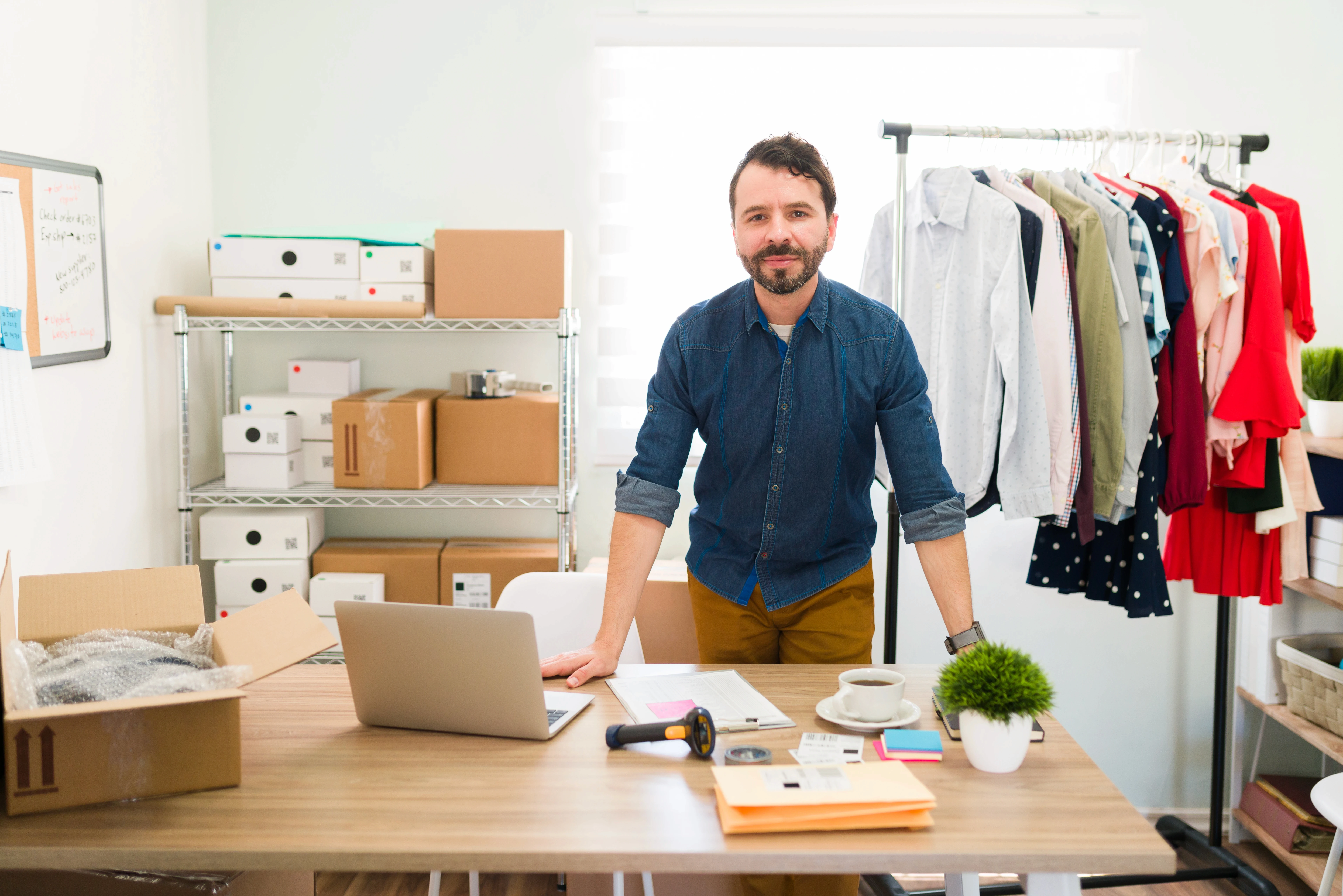 hispanic-young-entrepreneur-his-office-desk-working-making-packages-with-fashion-clothes-ship-their-customers
