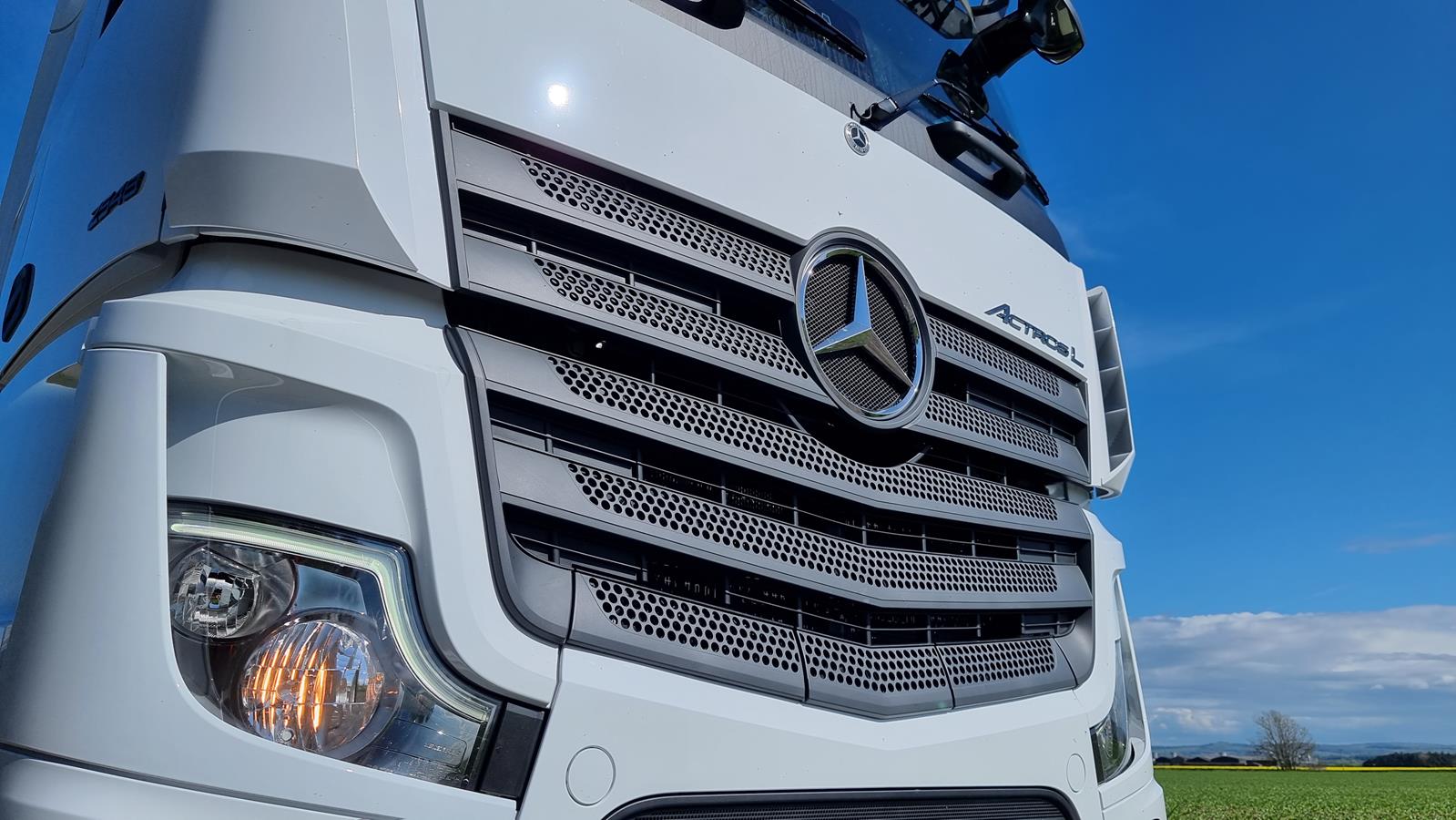 View of containers in motion at a large logistics hub located in a port.