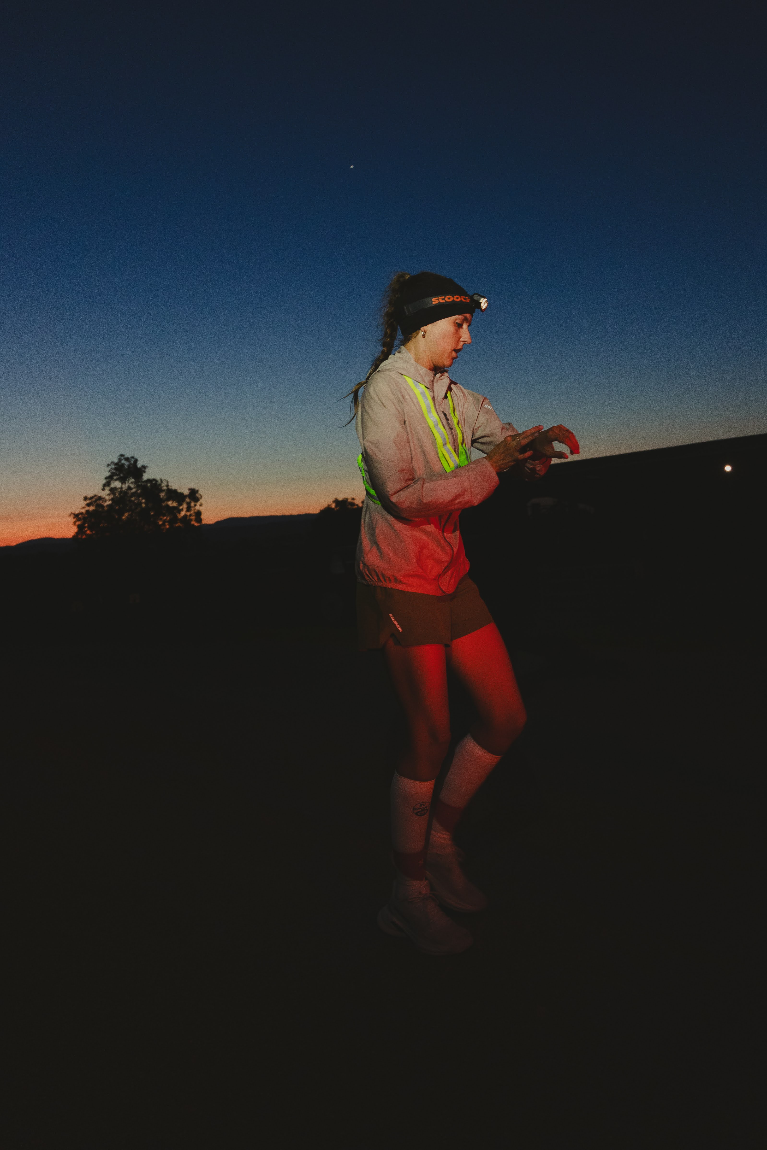 A Woman Trail Runner by night