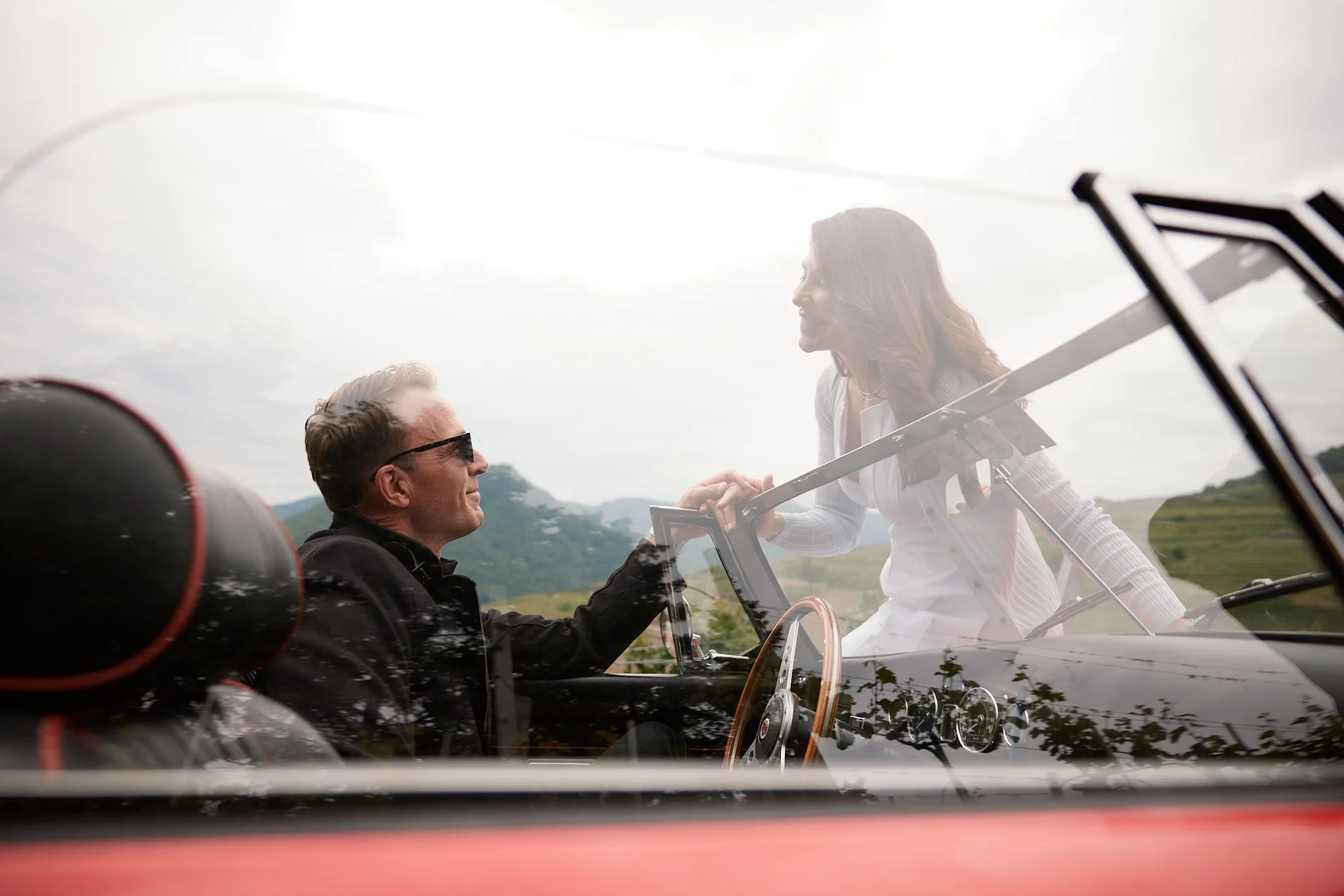 couple sharing glance in vintage convertible — lifestyle photography by Tom Kubik