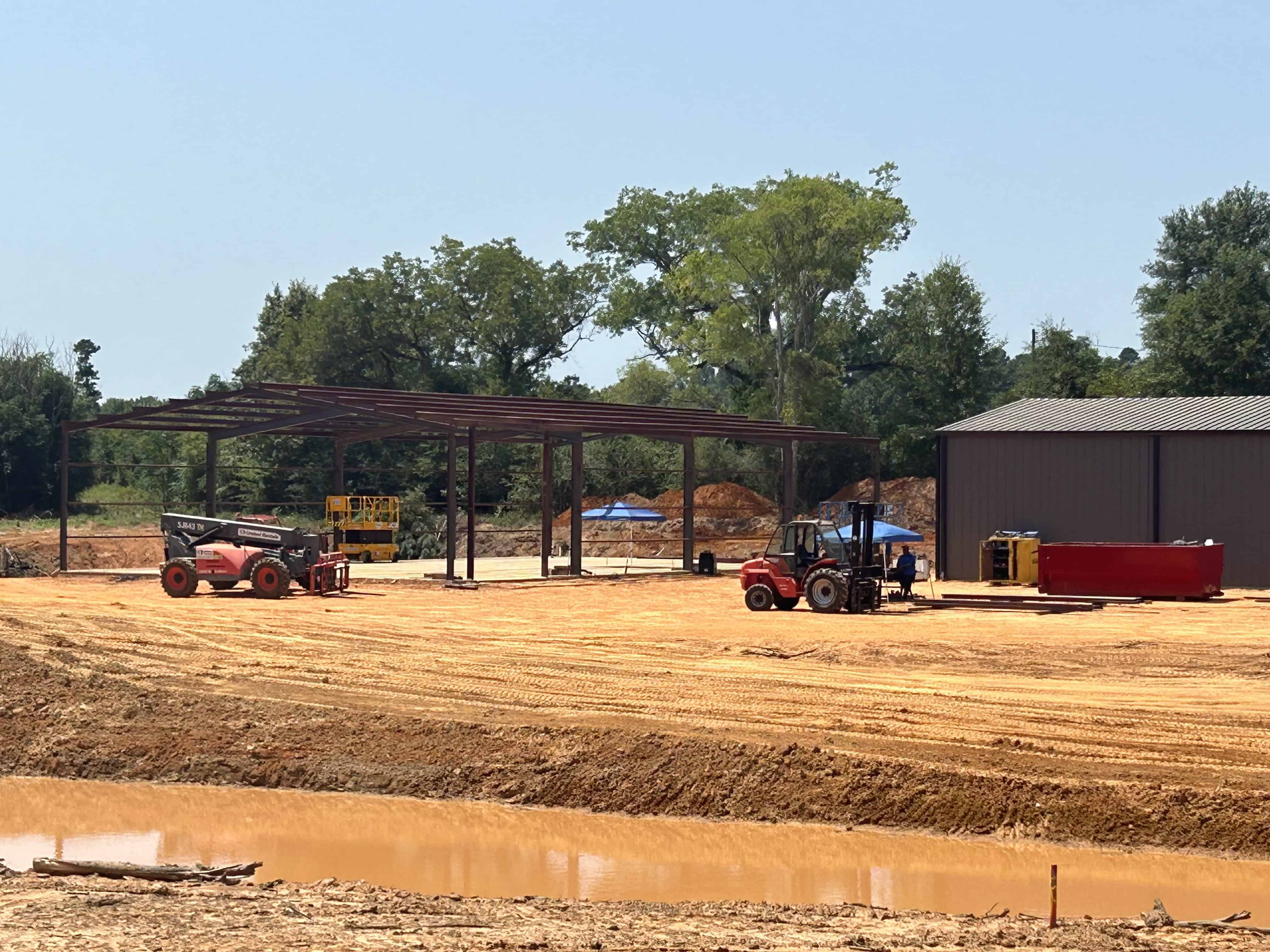 This is a site photo of a dealership we built in Henderson, Texas.  This is the shell of the PEMB metal building we installed onsite.  We used MIG and stick welding services to complete this project.