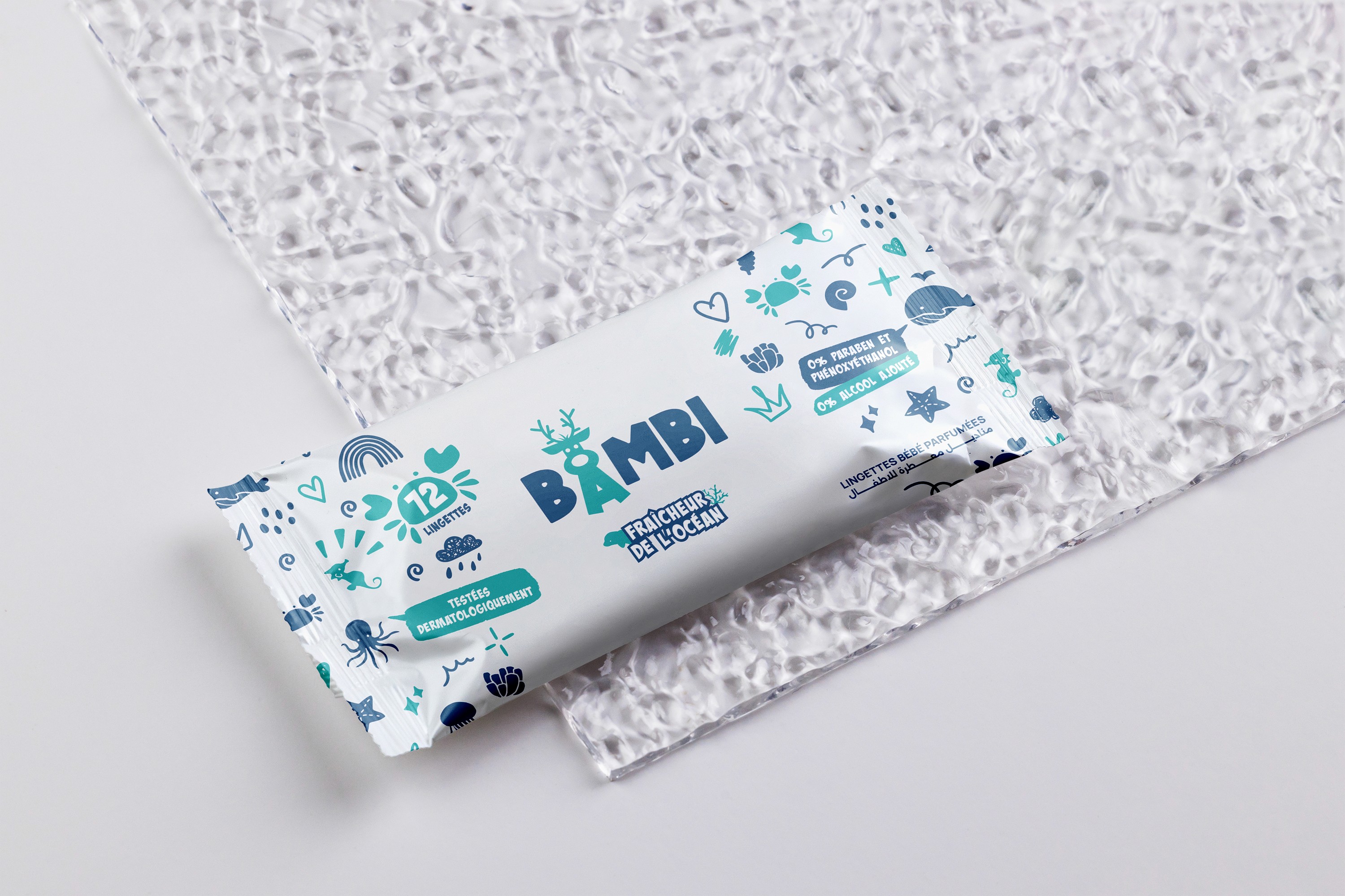 Three slim, upright orange packaging boxes side by side, each showing a partial black smiley face and “Smiley Co” text on the top, with a matching orange background.