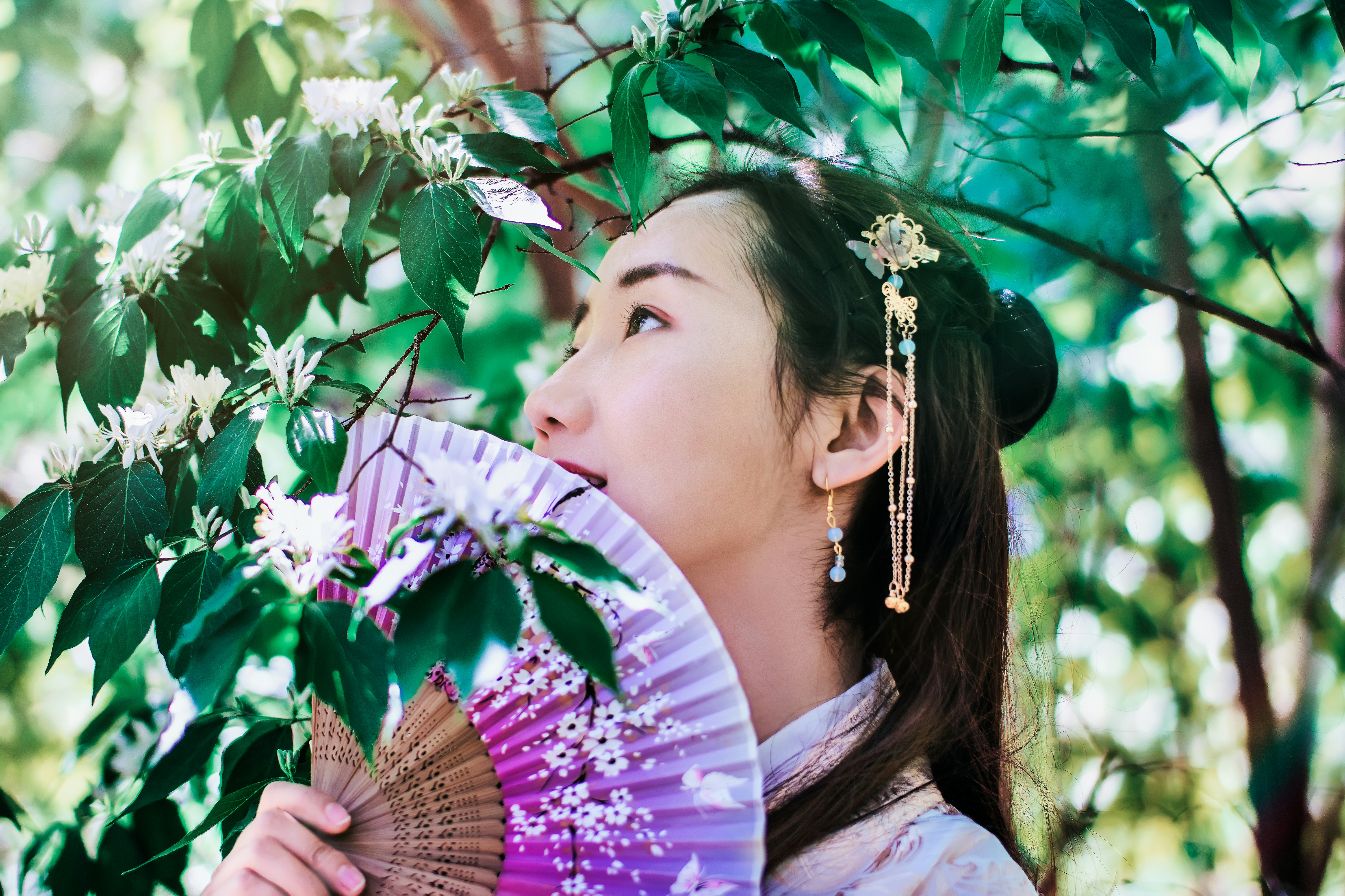 korean woman in a garden - 10-Step Skincare Routine