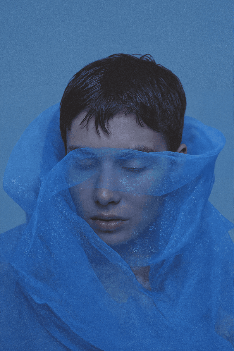 a woman face in blue cloth