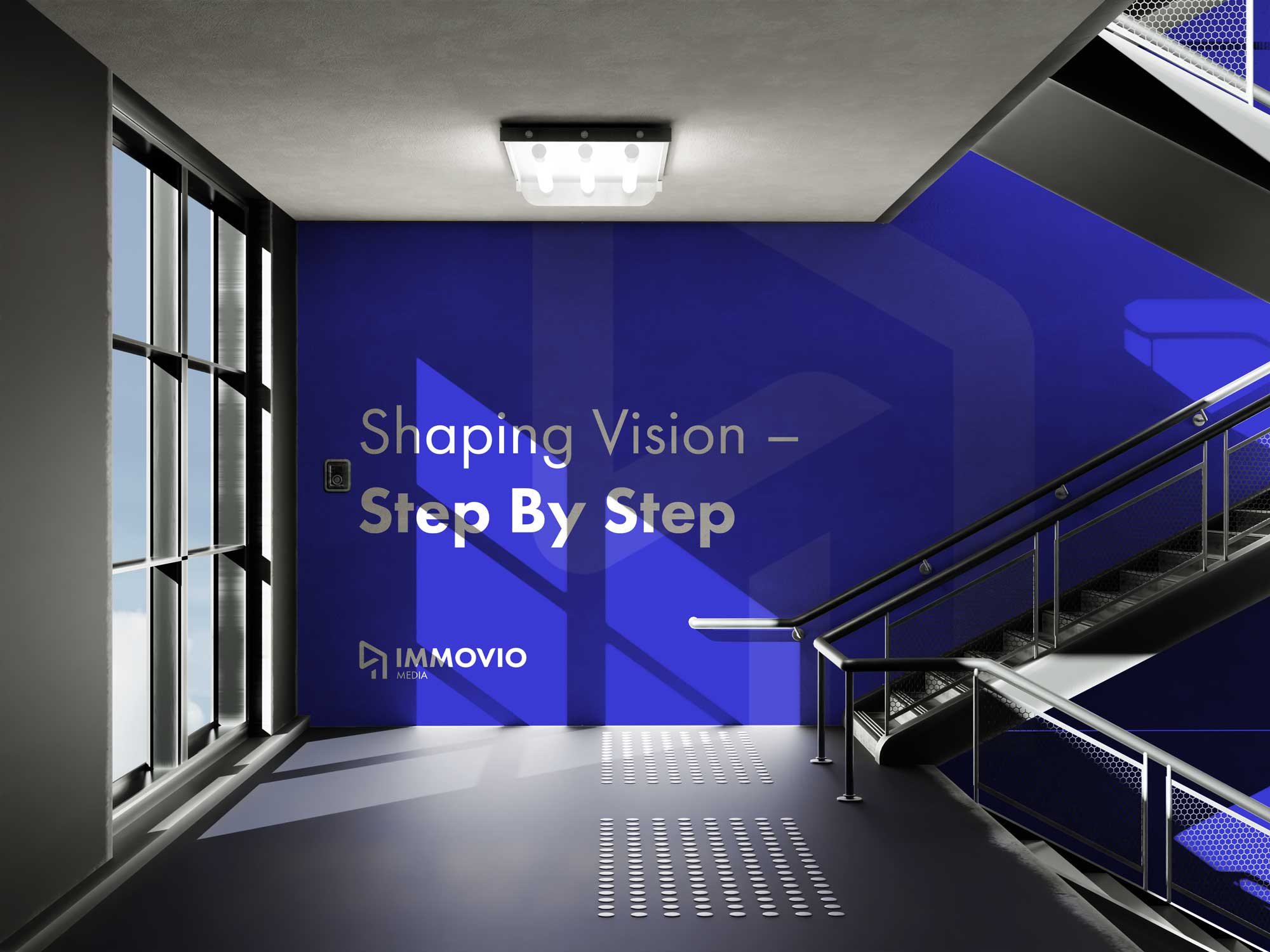Vivid blue Immovio brand identity applied with clear hierarchy to an architectural stairwell