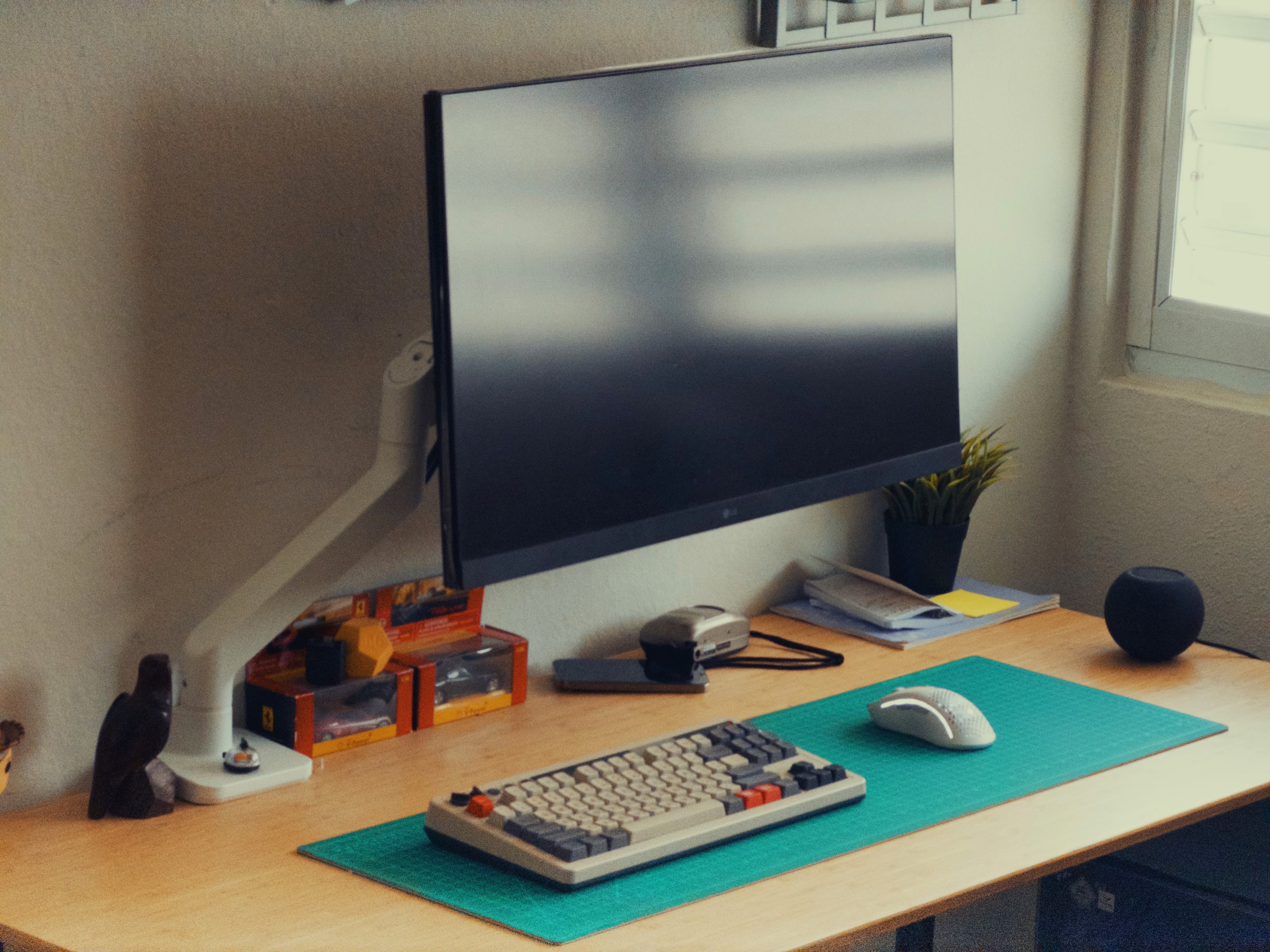 Desk with monitor, laptop, ps5 and pc.