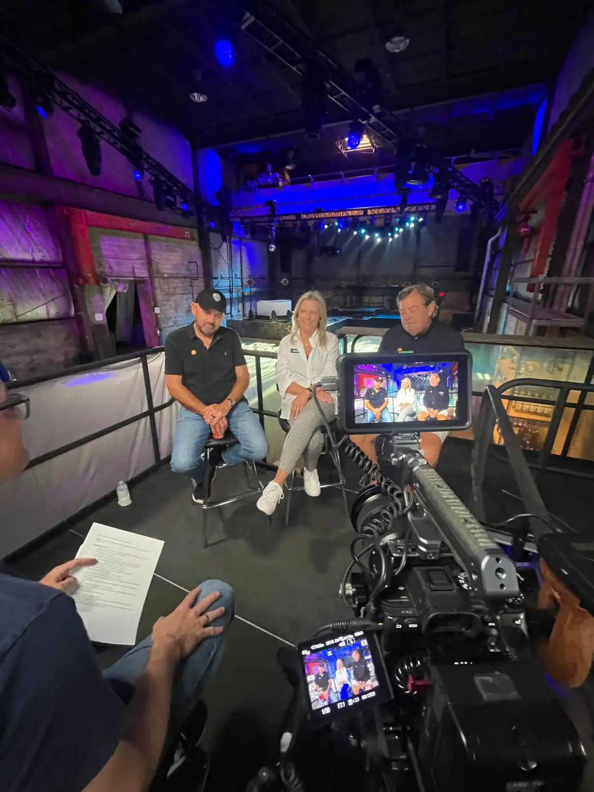 Business event video coverage with professional audio and lighting setup