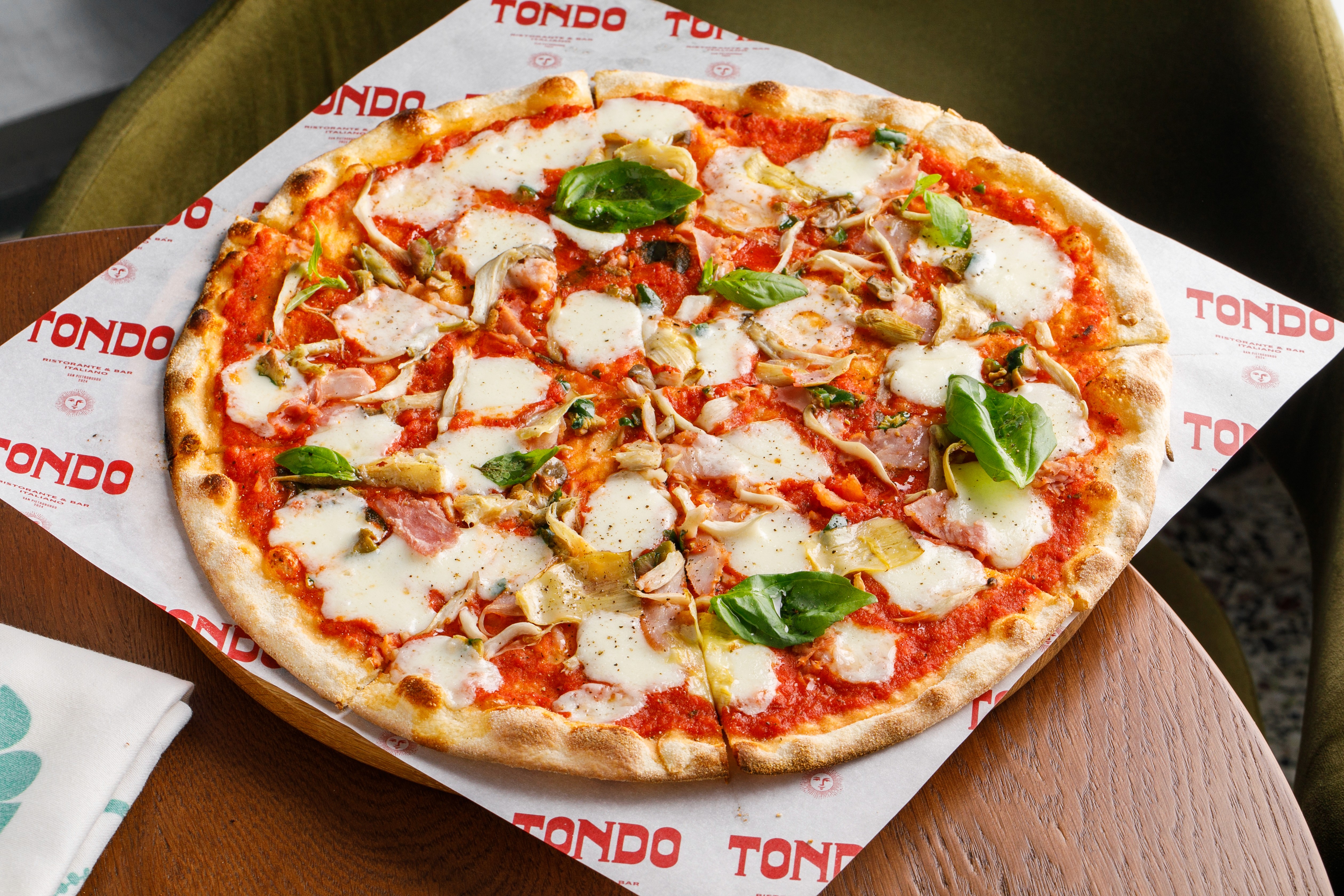 Streetside billboard with flyposters of the Batch.Works brand and illustrations