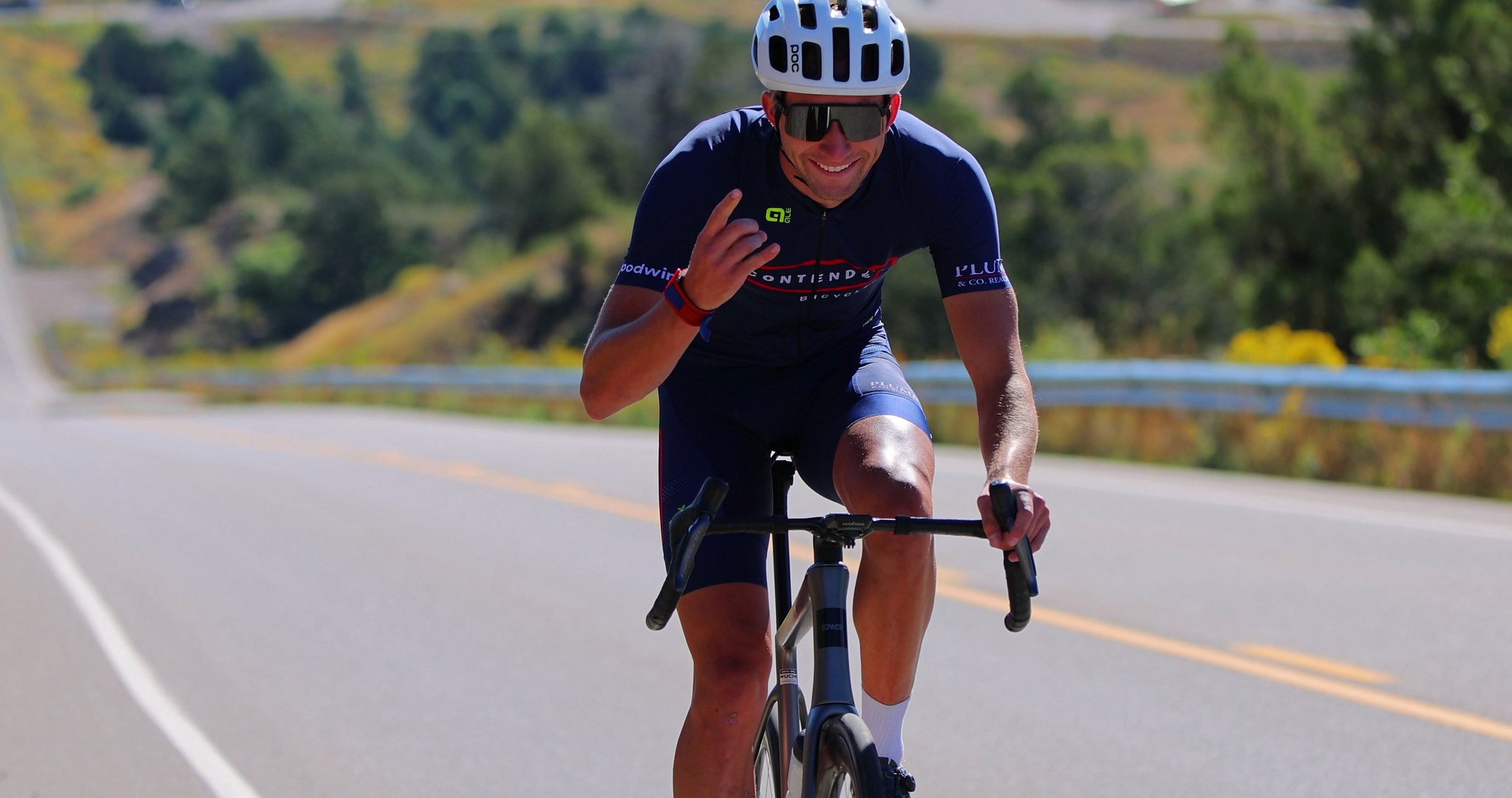 Road cyclist climbing toward the camera on the course