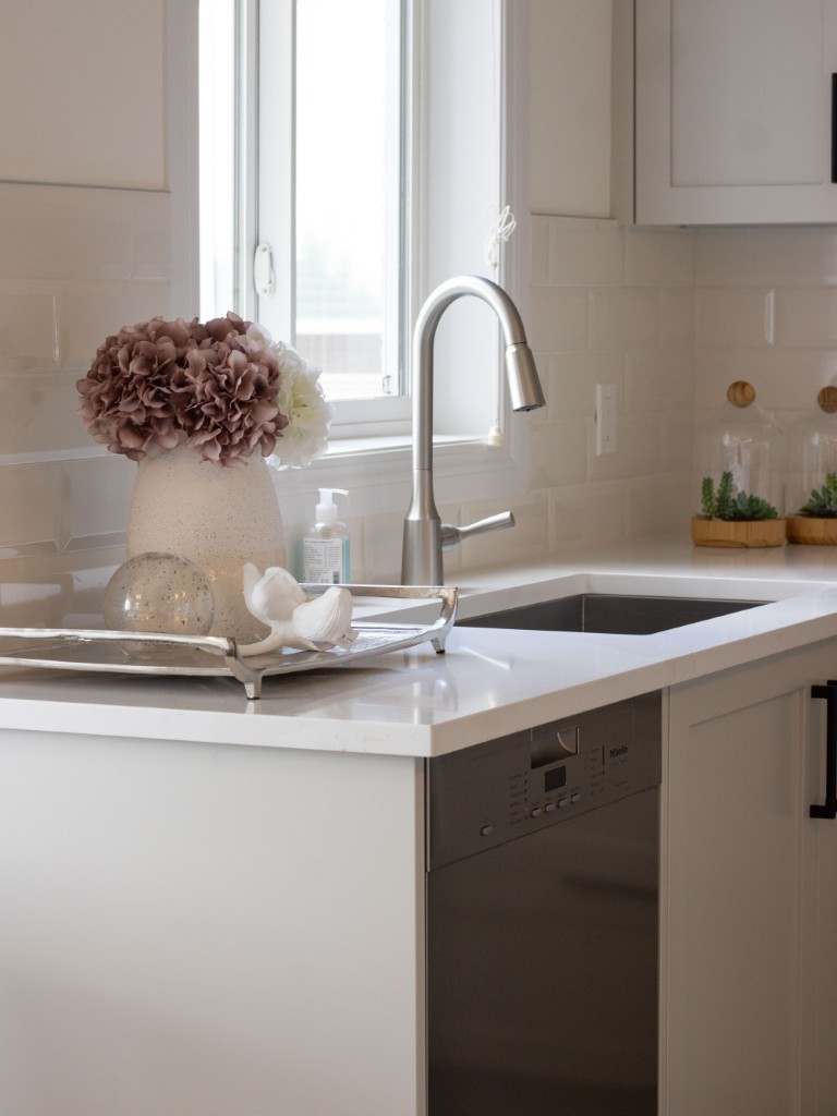 Image of Modern kitchen design with white countertops, stainless steel sink and faucet, and KHD home renovations.