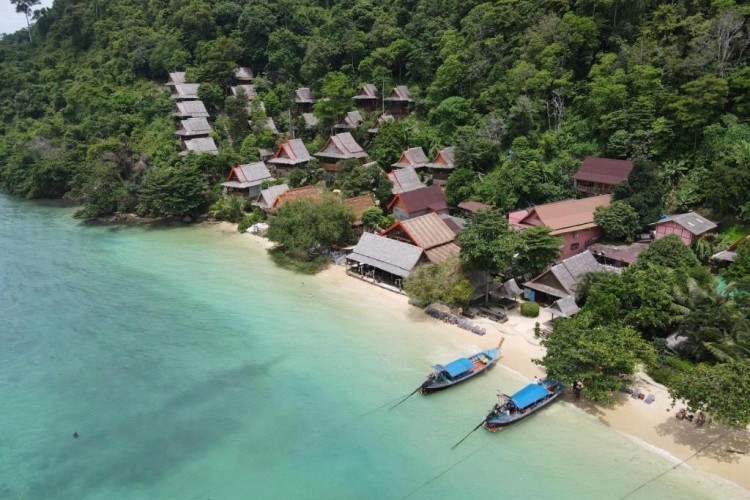 sunloungers fronting buildings near mountain
