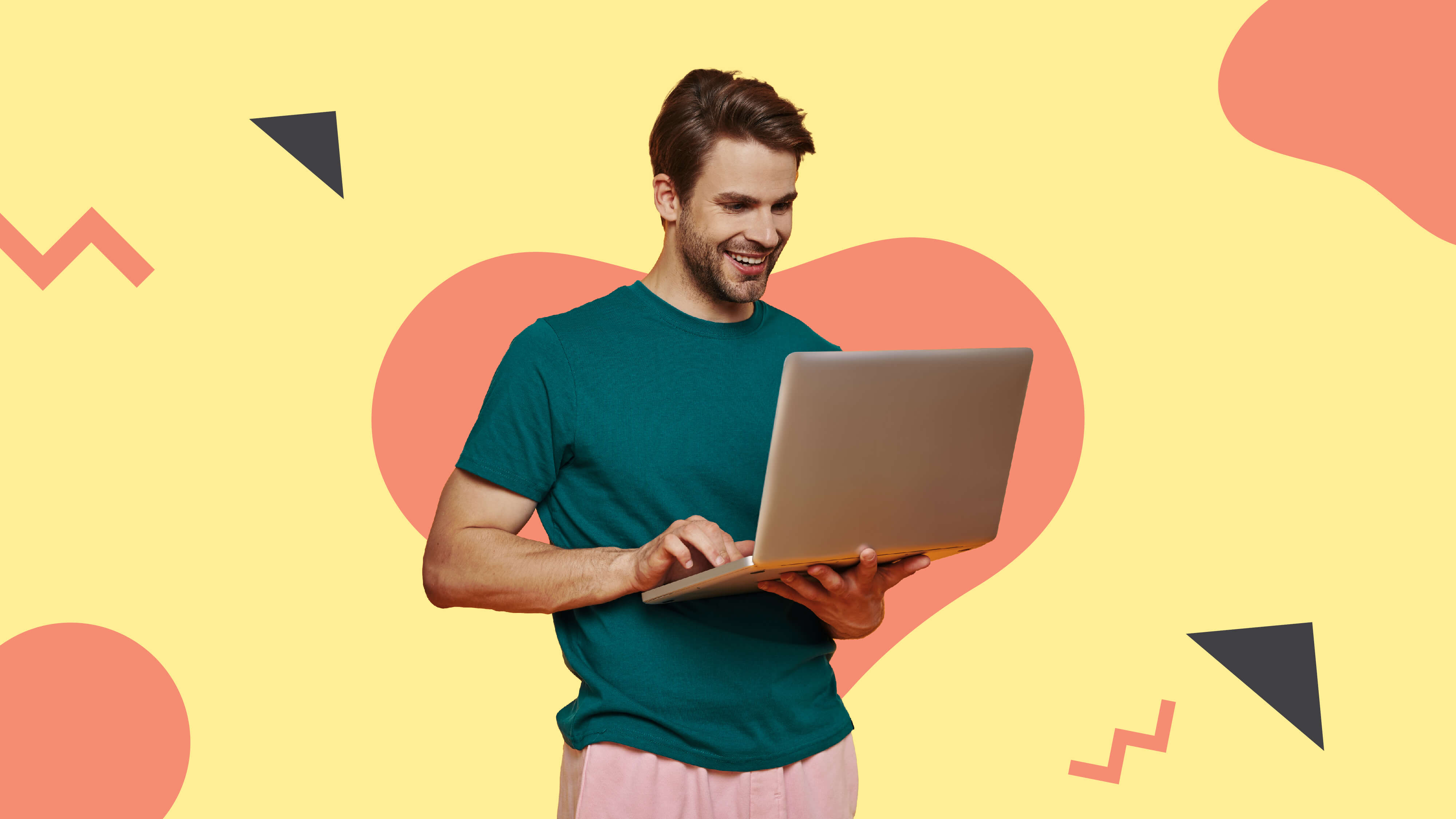 Men holding a laptop while standing