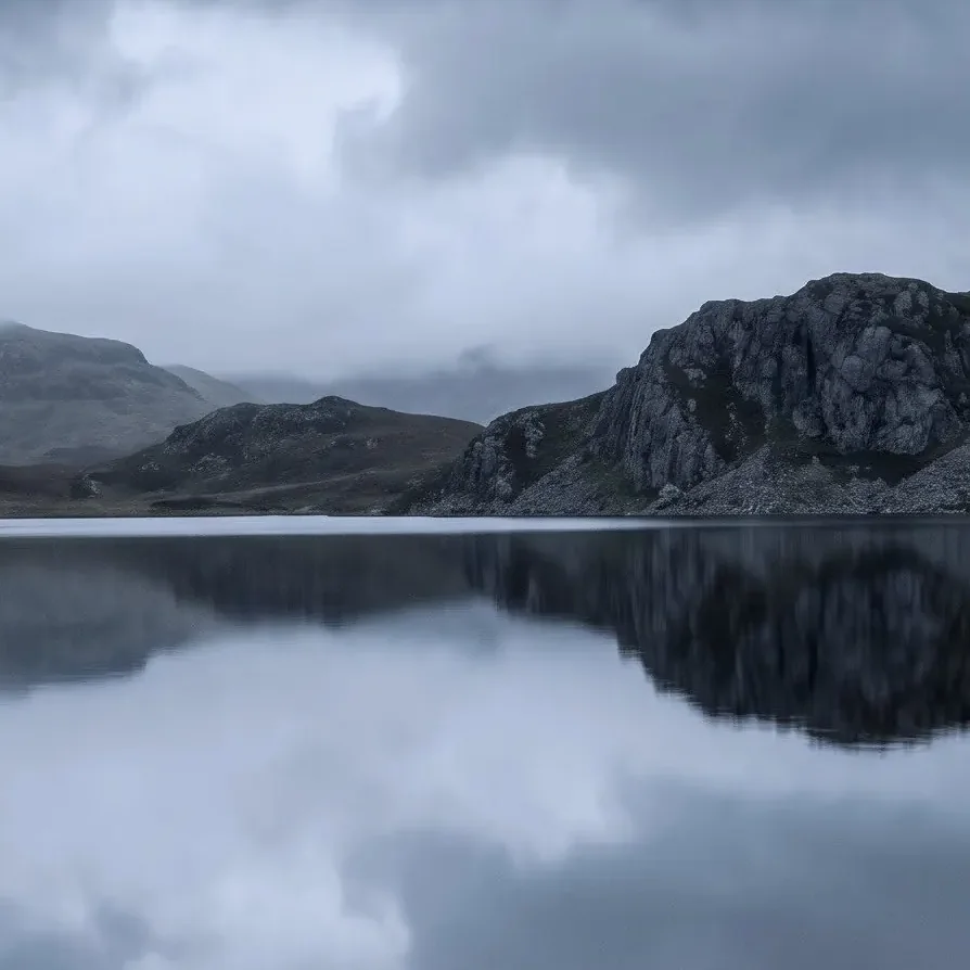 Album cover: a still loch mirroring a dark mountain under grey cloud