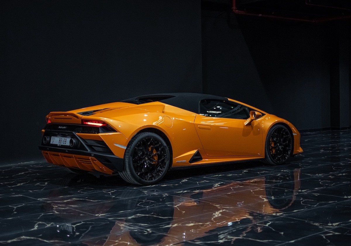 Lamborghini Huracán EVO Spyder AWD 2023 orange side profile convertible supercar rental