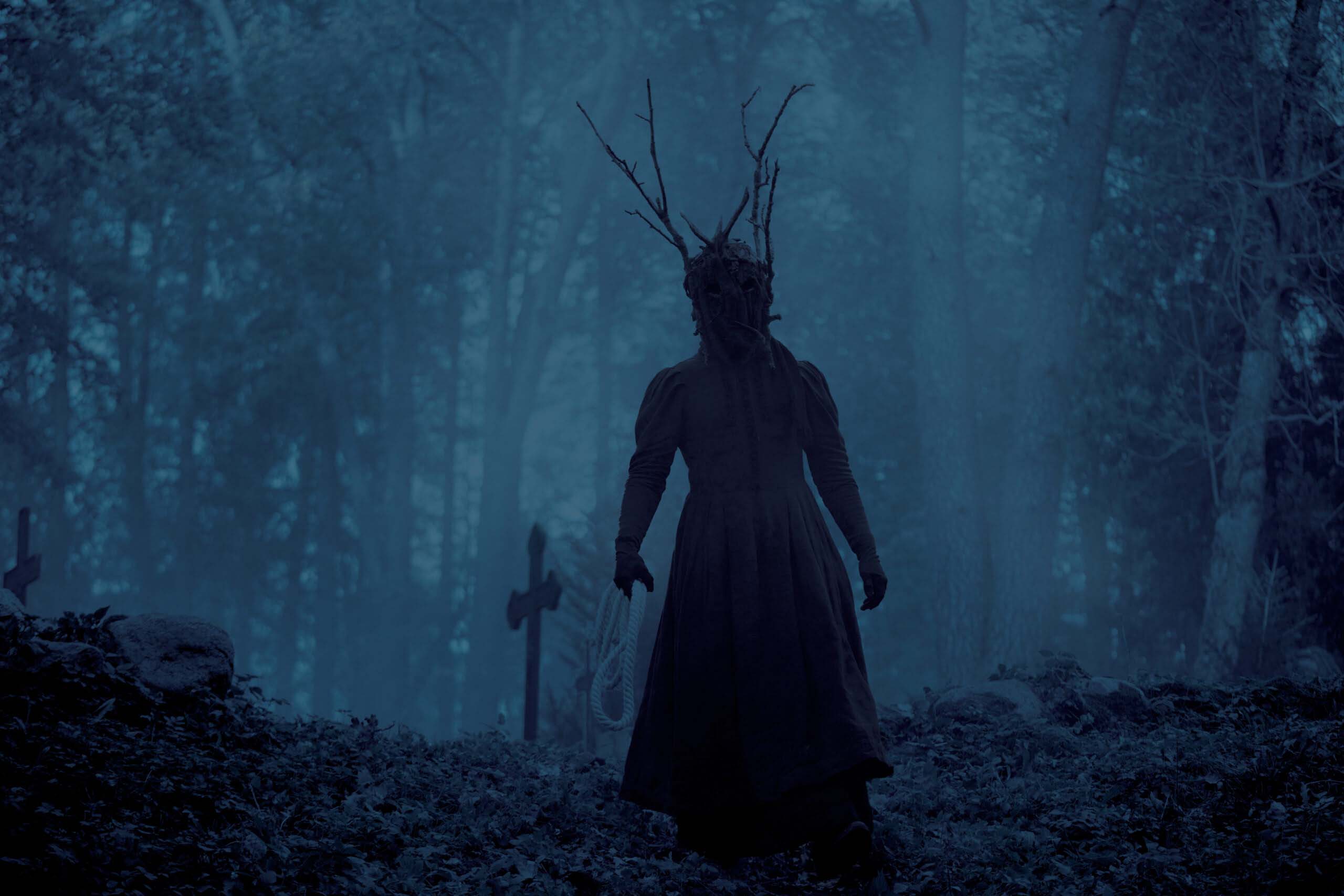 Horrifying shadow-like creature standing in darkness in The Shadow (Vari), an Estonian fantasy-mystic film blending horror and psychological drama.