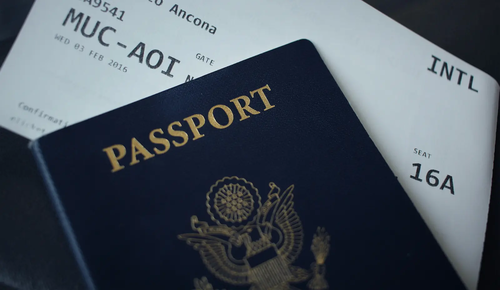 U.S. passport and boarding pass symbolizing immigration travel documents