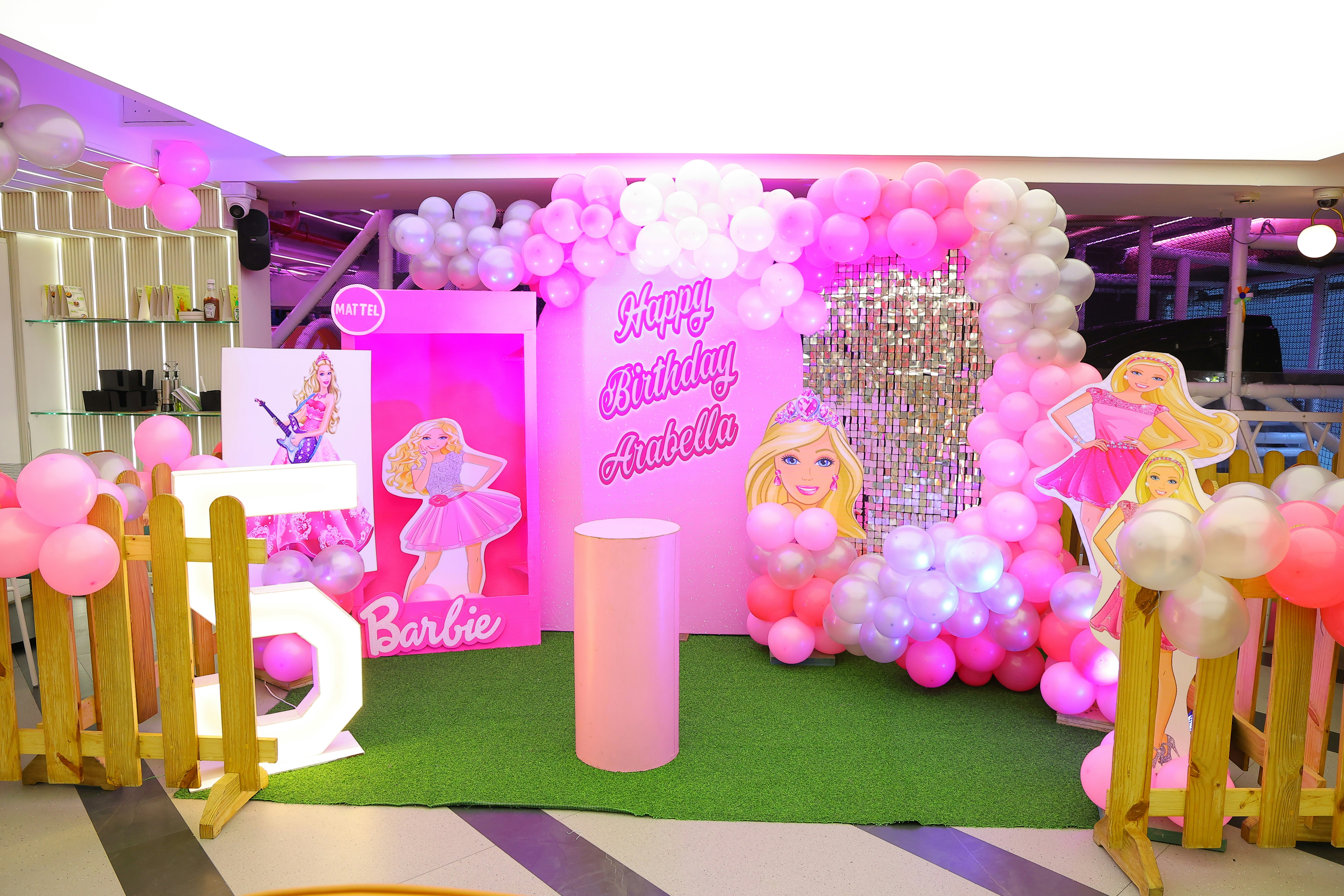 Barbie themed birthday party decoration with balloons