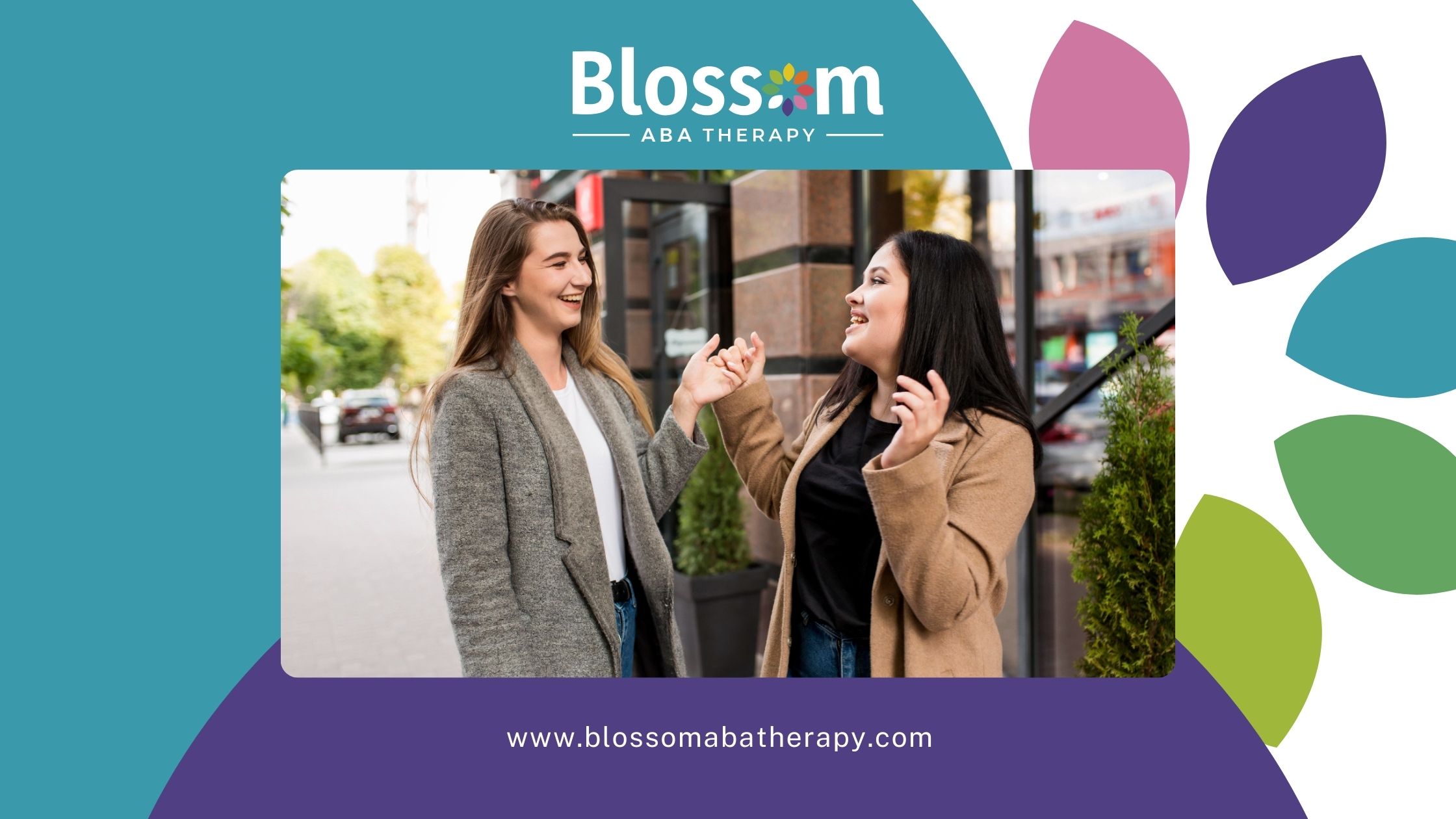 Two women laughing and enjoying a conversation outdoors.