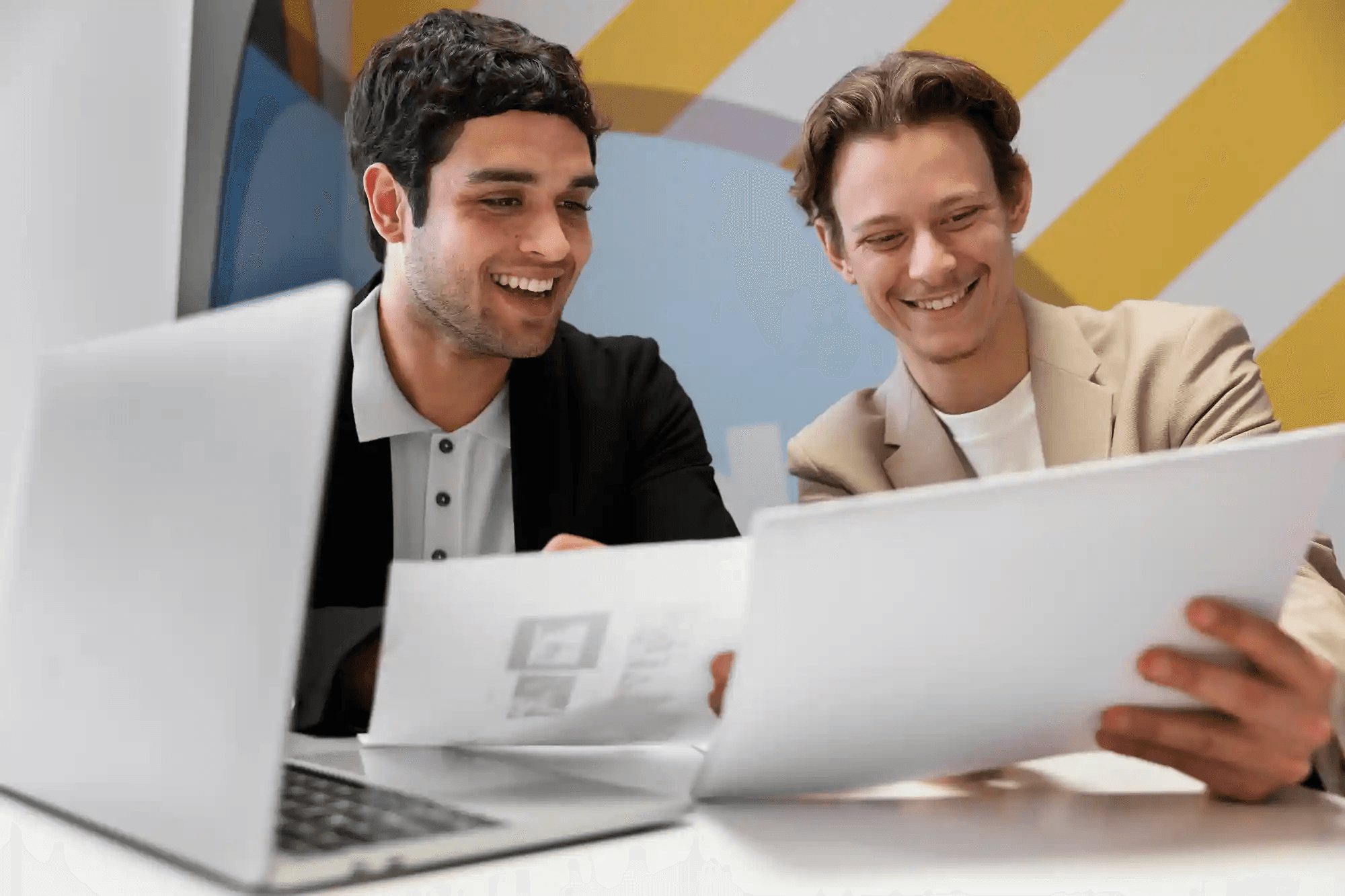 Colleagues reviewing documents together - Automated Lead Qualification