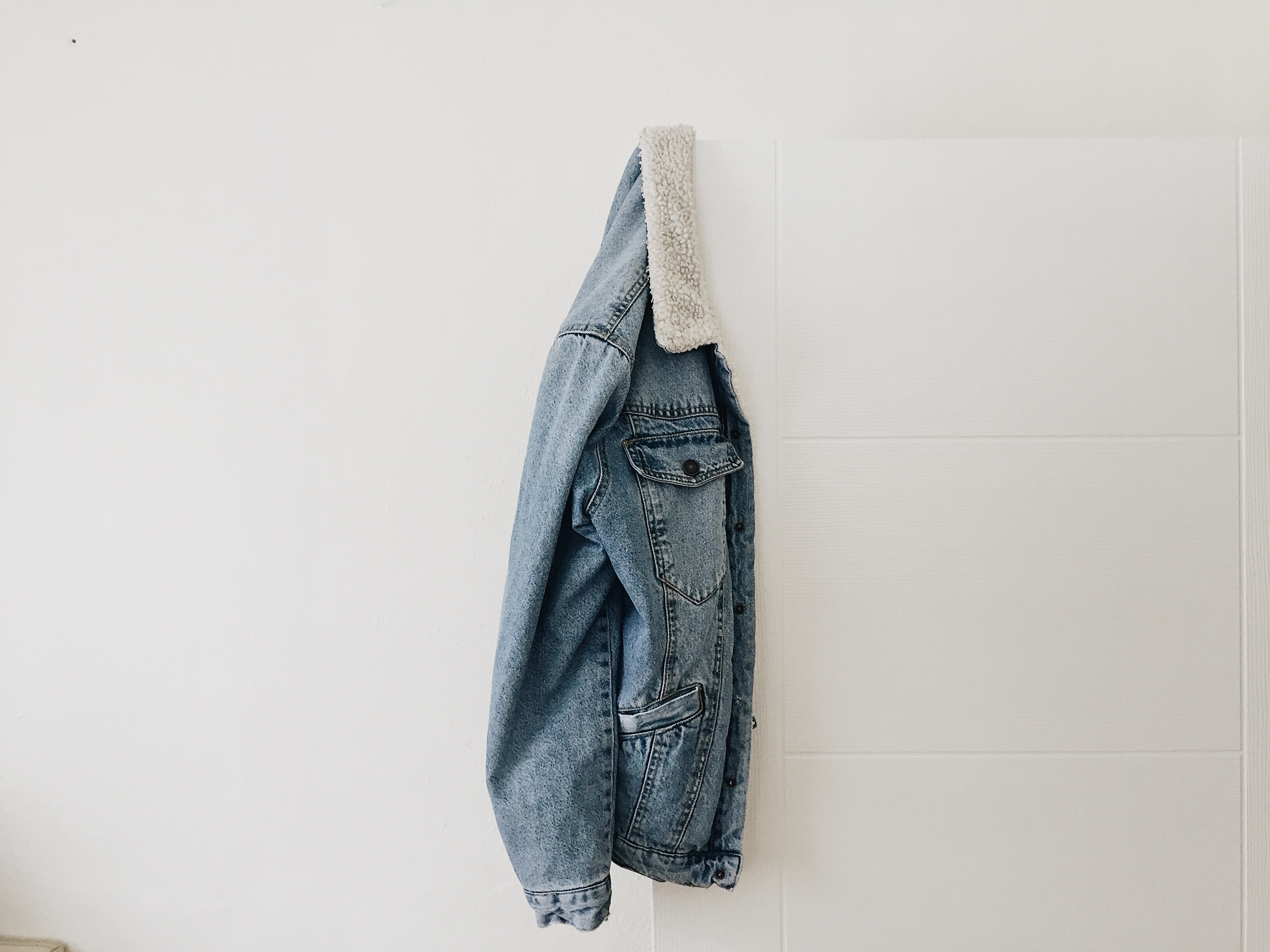 Denim jacket hanging on a hook