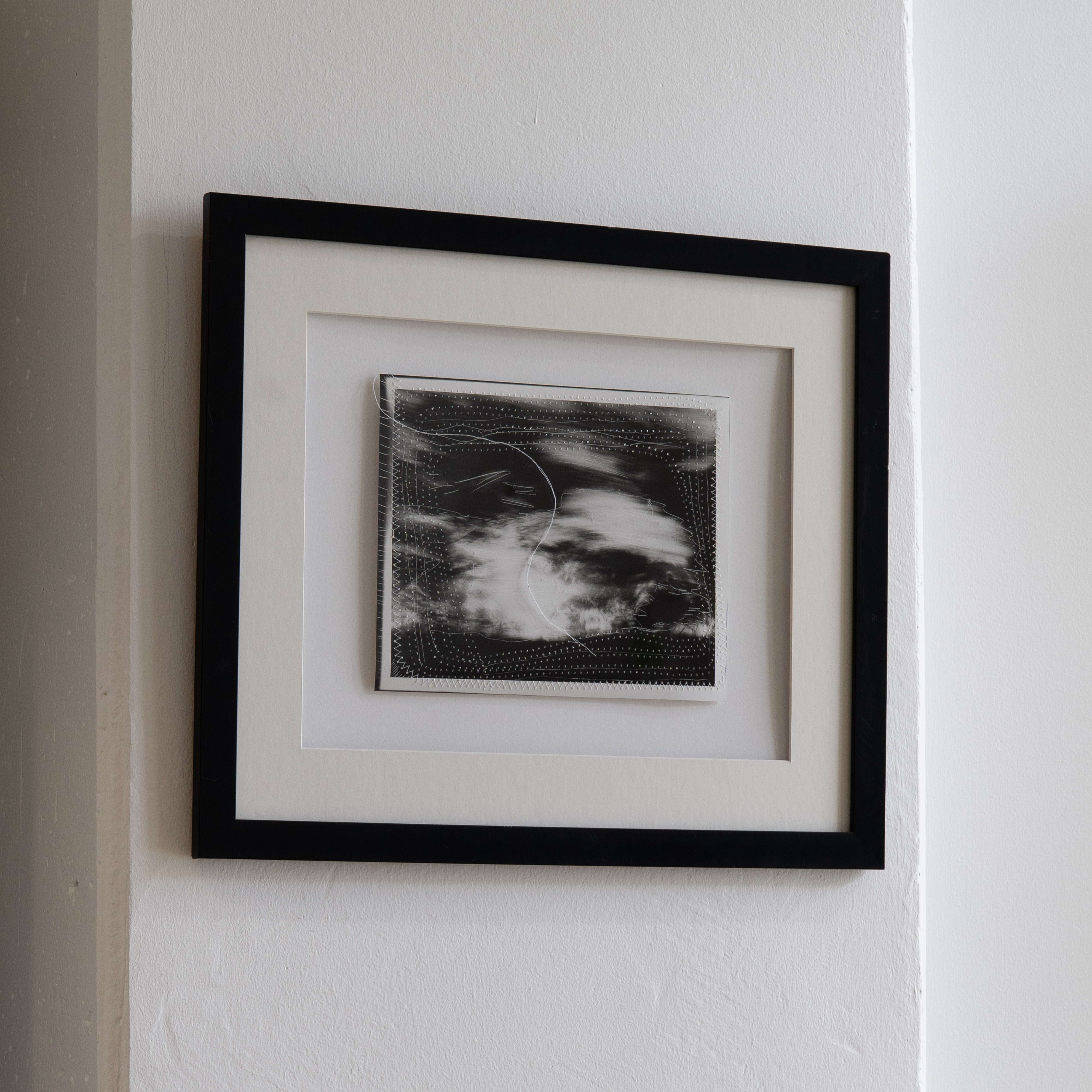 Darkroom prints drying on wire racks