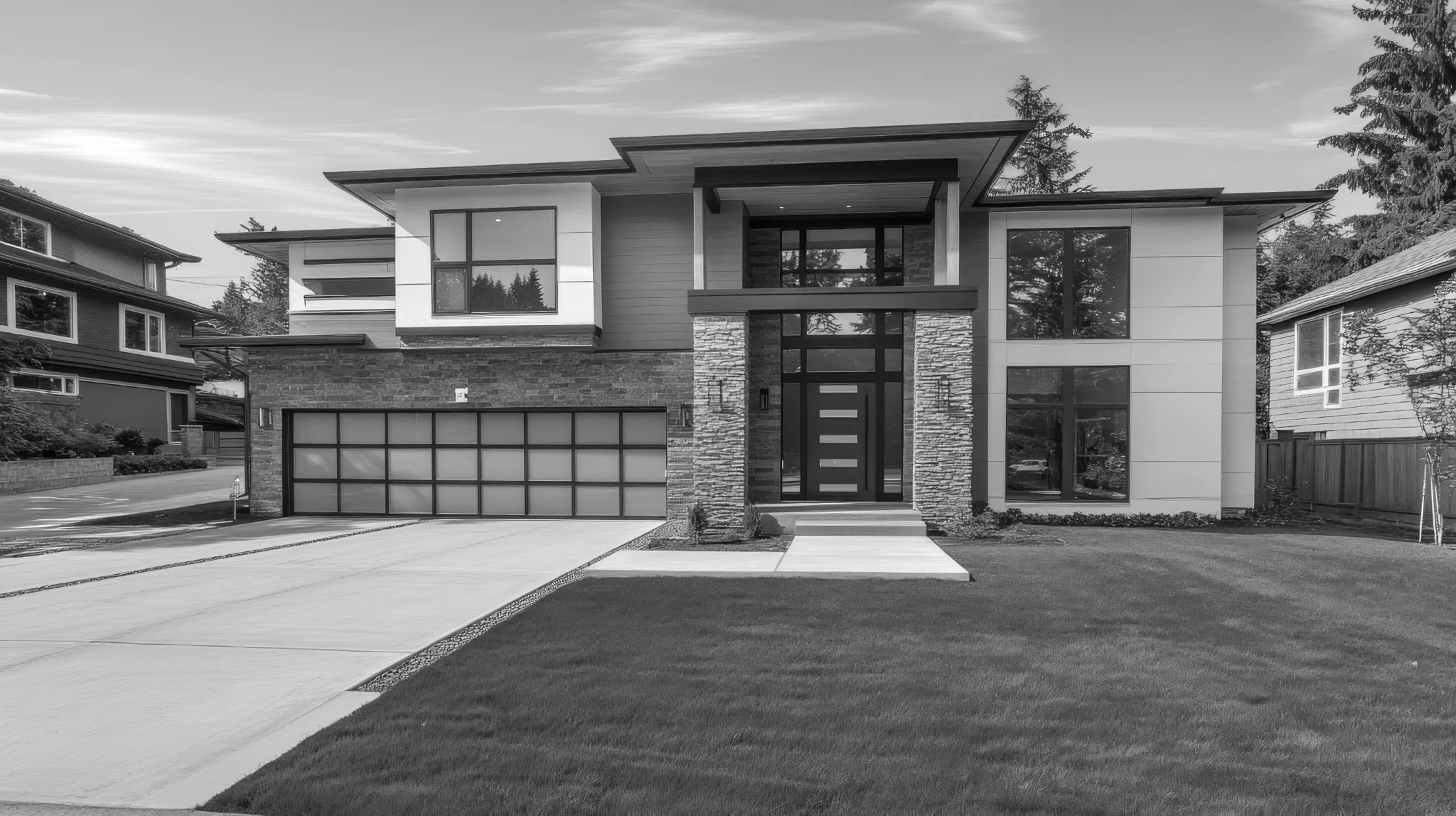 Black and white photo of a facade of a house.